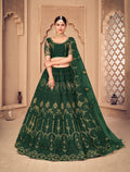 Dark green net lehenga choli with beautiful thread work embroidery.