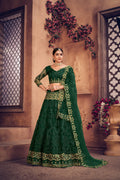 Dark green net lehenga choli featuring fine thread embroidery for festive occasions.