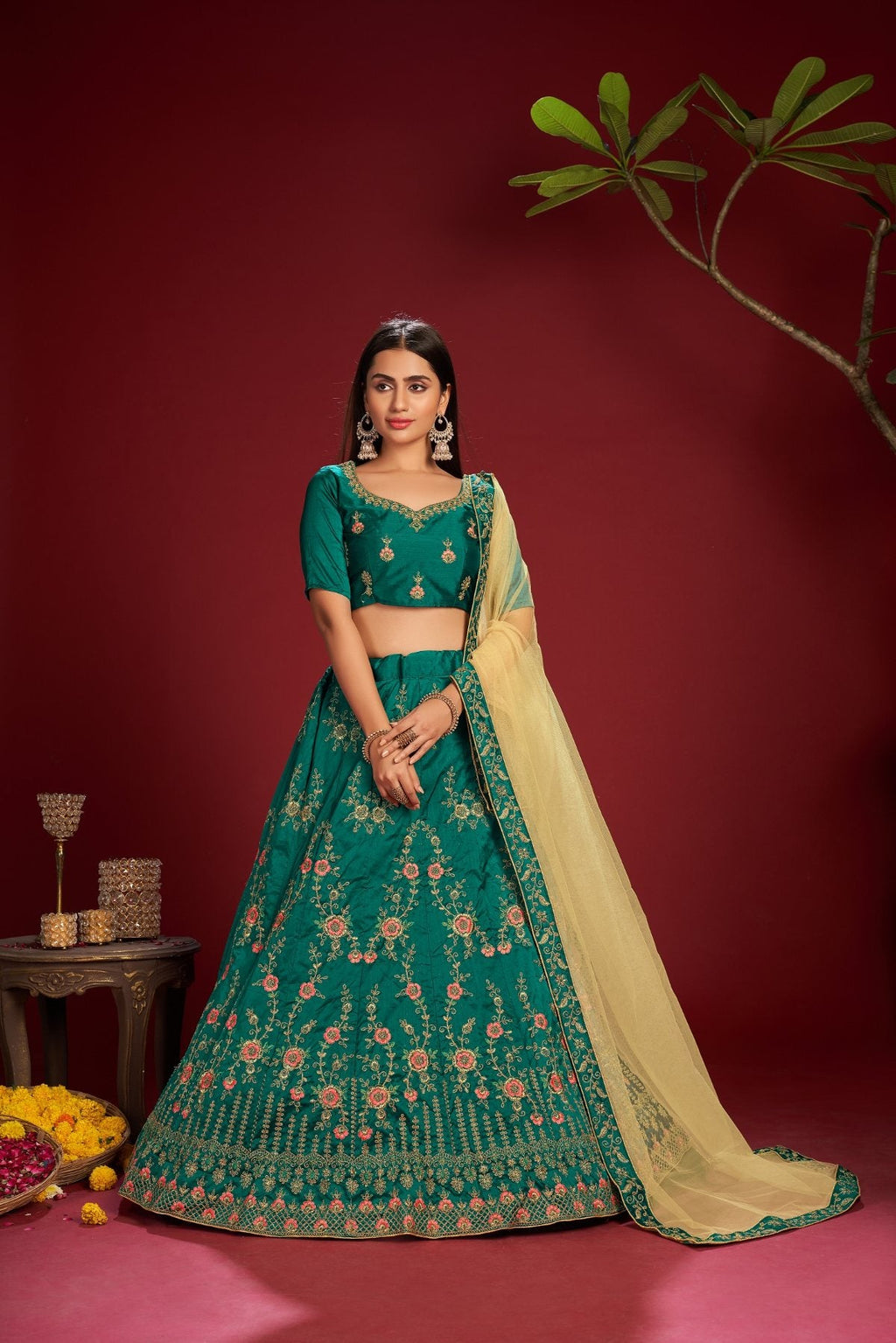 Dark green taffeta silk lehenga choli with intricate thread embroidery for festive wear.