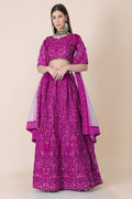 Woman wearing a Purple Taffeta Silk Lehenga Choli with intricate thread embroidery