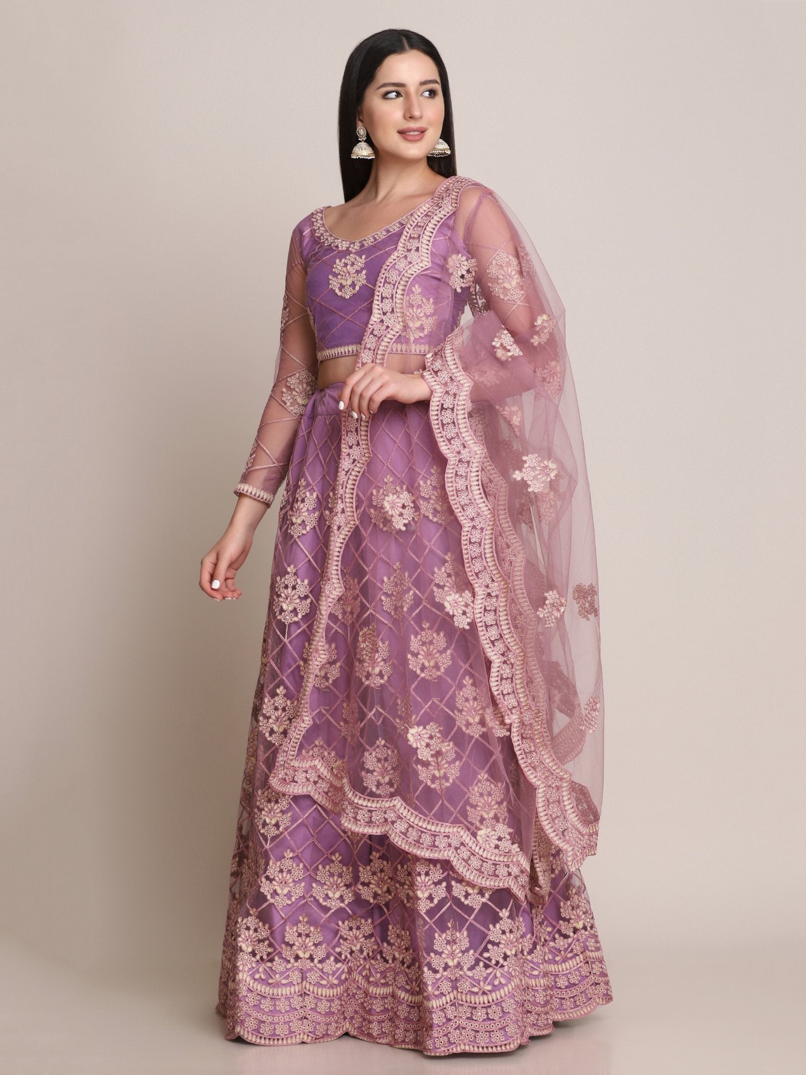 Purple Net Lehenga Choli with intricate thread work and elegant drape.