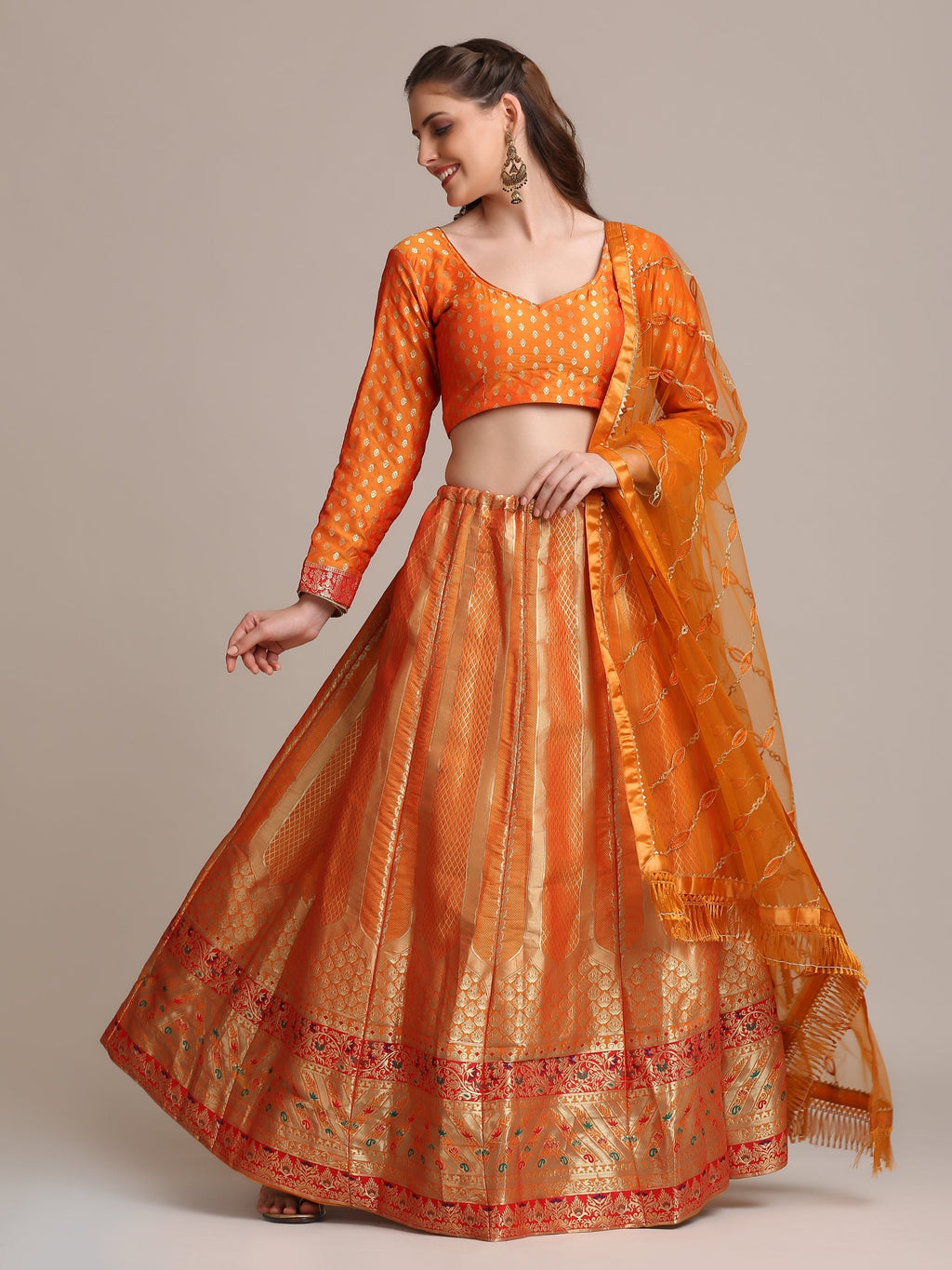 Orange Jacquard Silk lehenga choli with gold woven patterns and matching dupatta