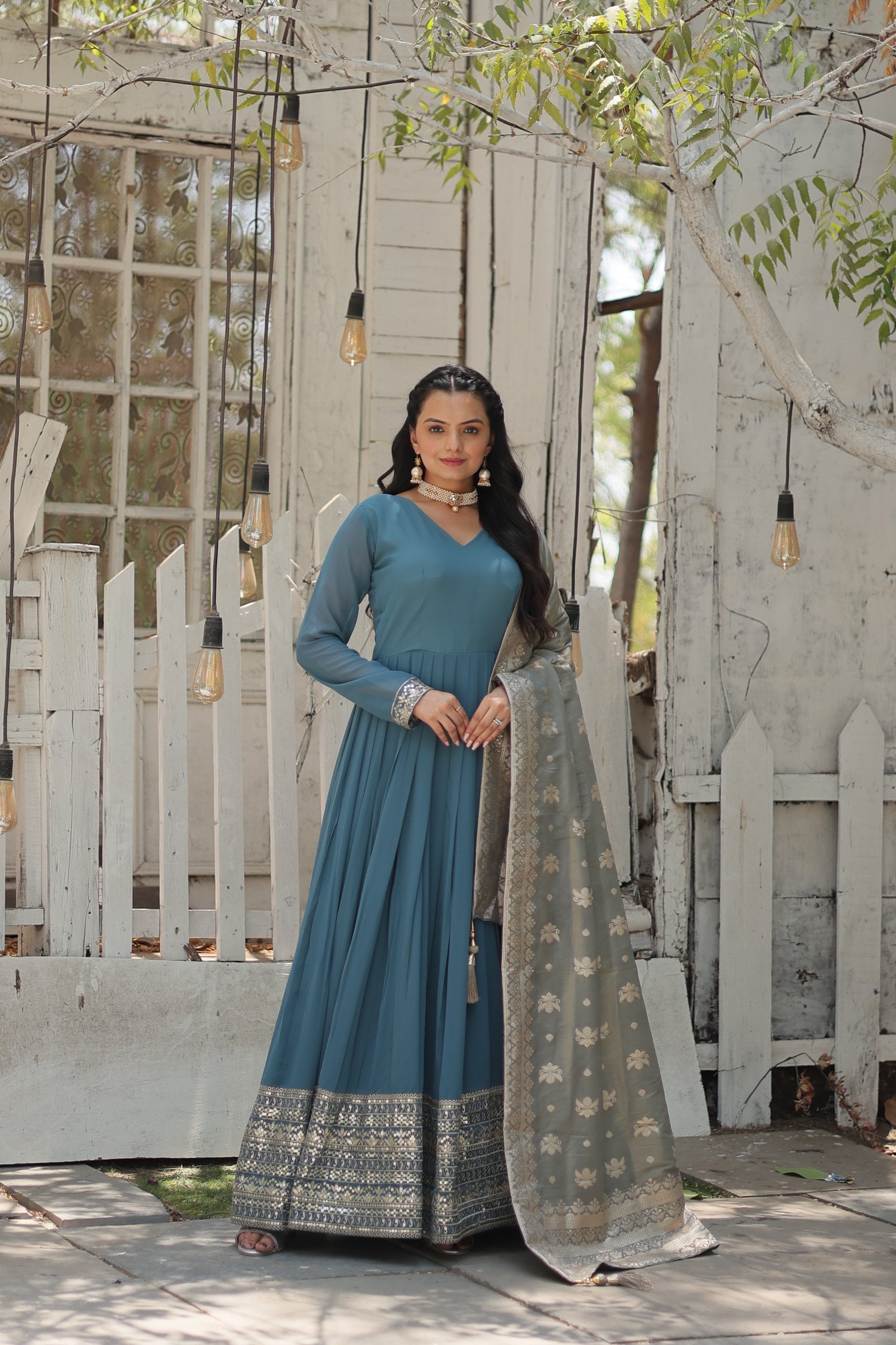 Sky blue Anarkali kurta with sequins and embroidery in faux georgette fabric with matching dupatta.