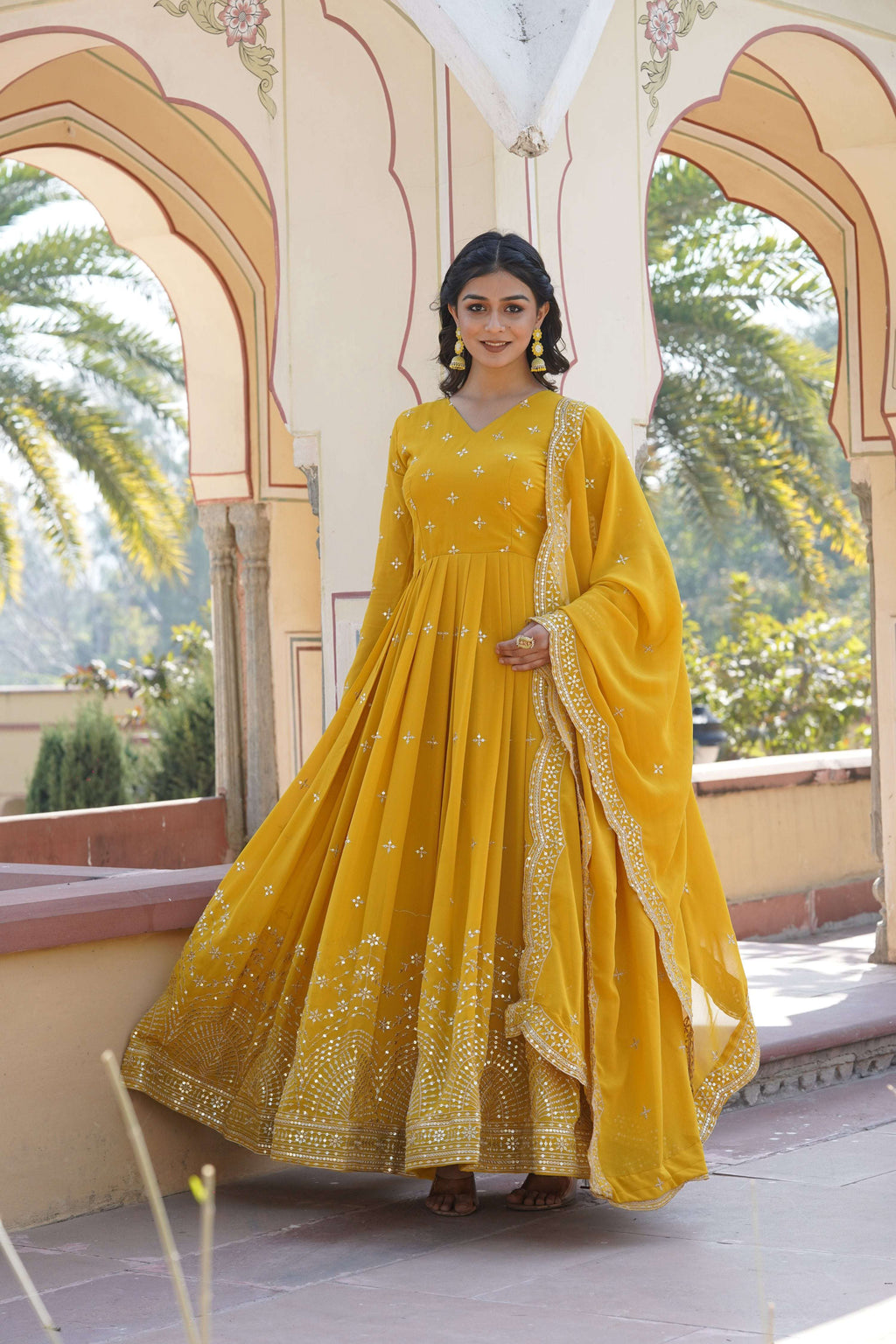Yellow Faux Georgette Anarkali Kurta with sequins and zari embroidery, including a matching dupatta.