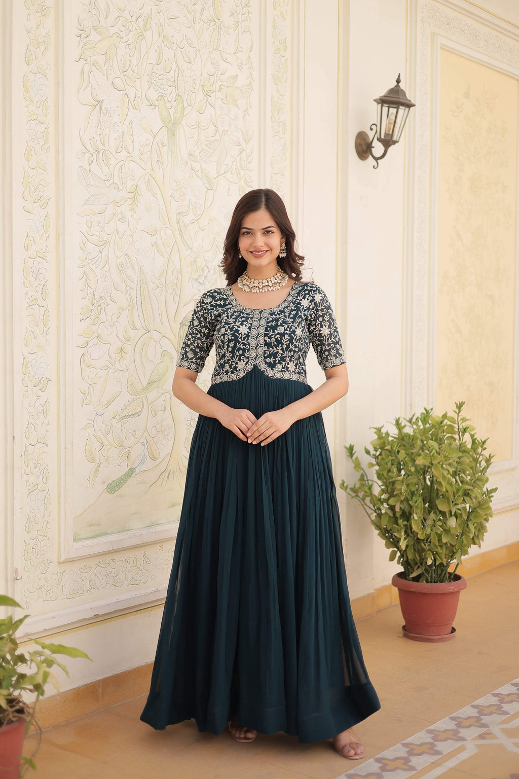 Rama colored floor-length Anarkali dress with gold zari and sequins embroidery