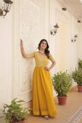 Beautiful yellow Anarkali dress adorned with silver sequins and Zari embroidery.