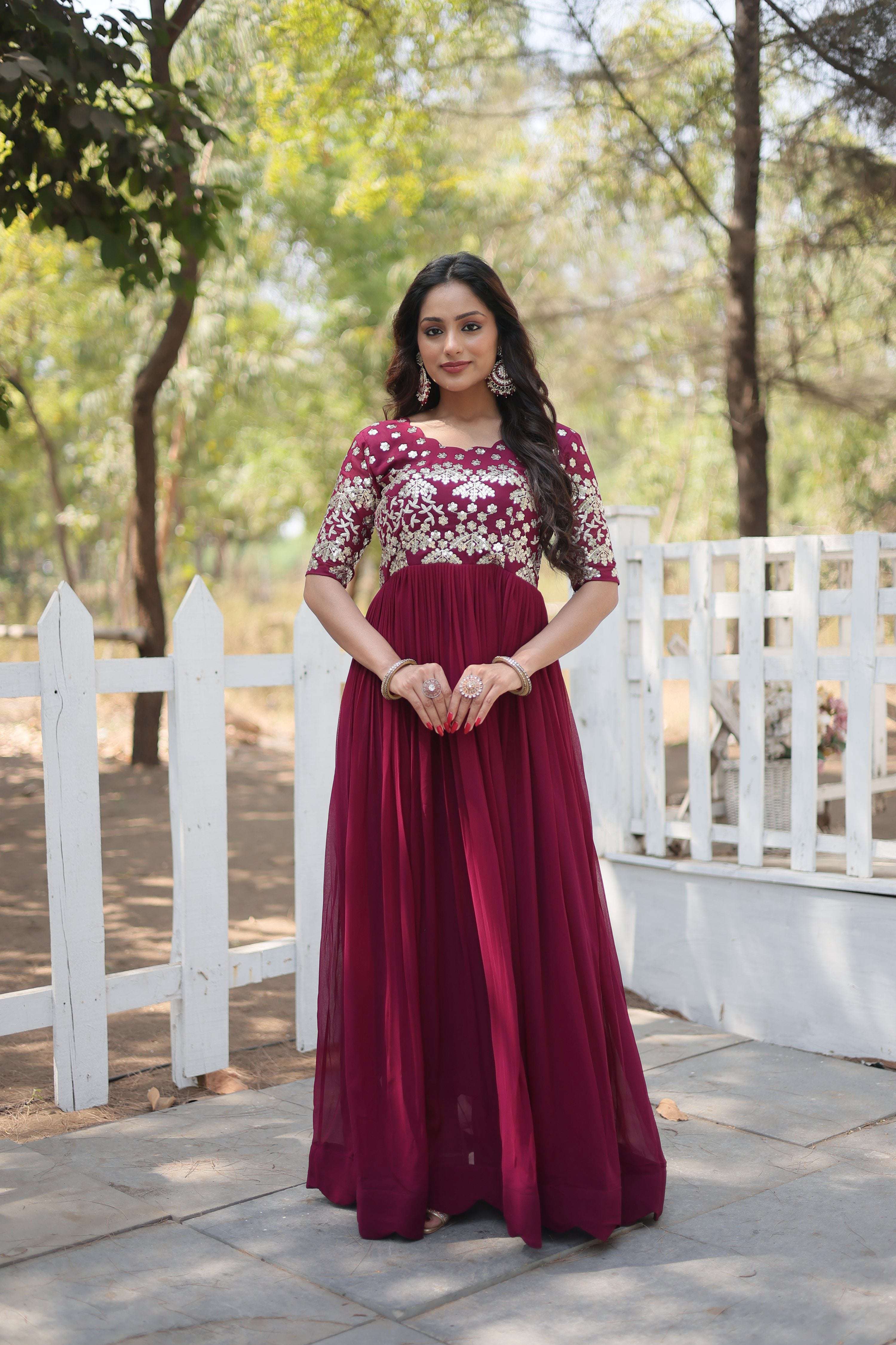 Elegant wine-colored floral Anarkali dress with gold sequins and embroidery.