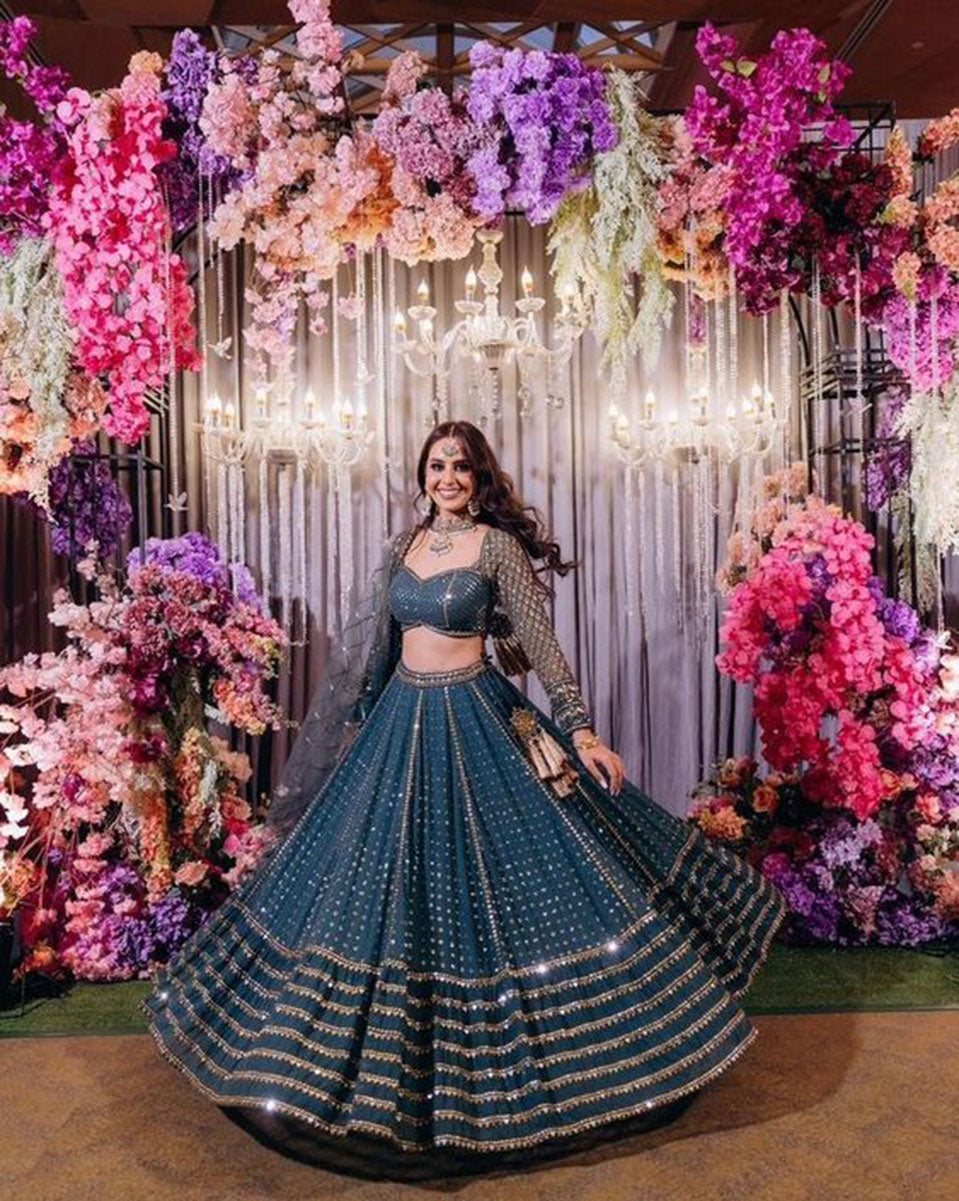 Blue faux georgette lehenga choli with heavy sequin and Zari embroidery