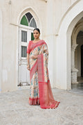 Firozi Tussar silk saree featuring intricate Zari floral weaving and red details