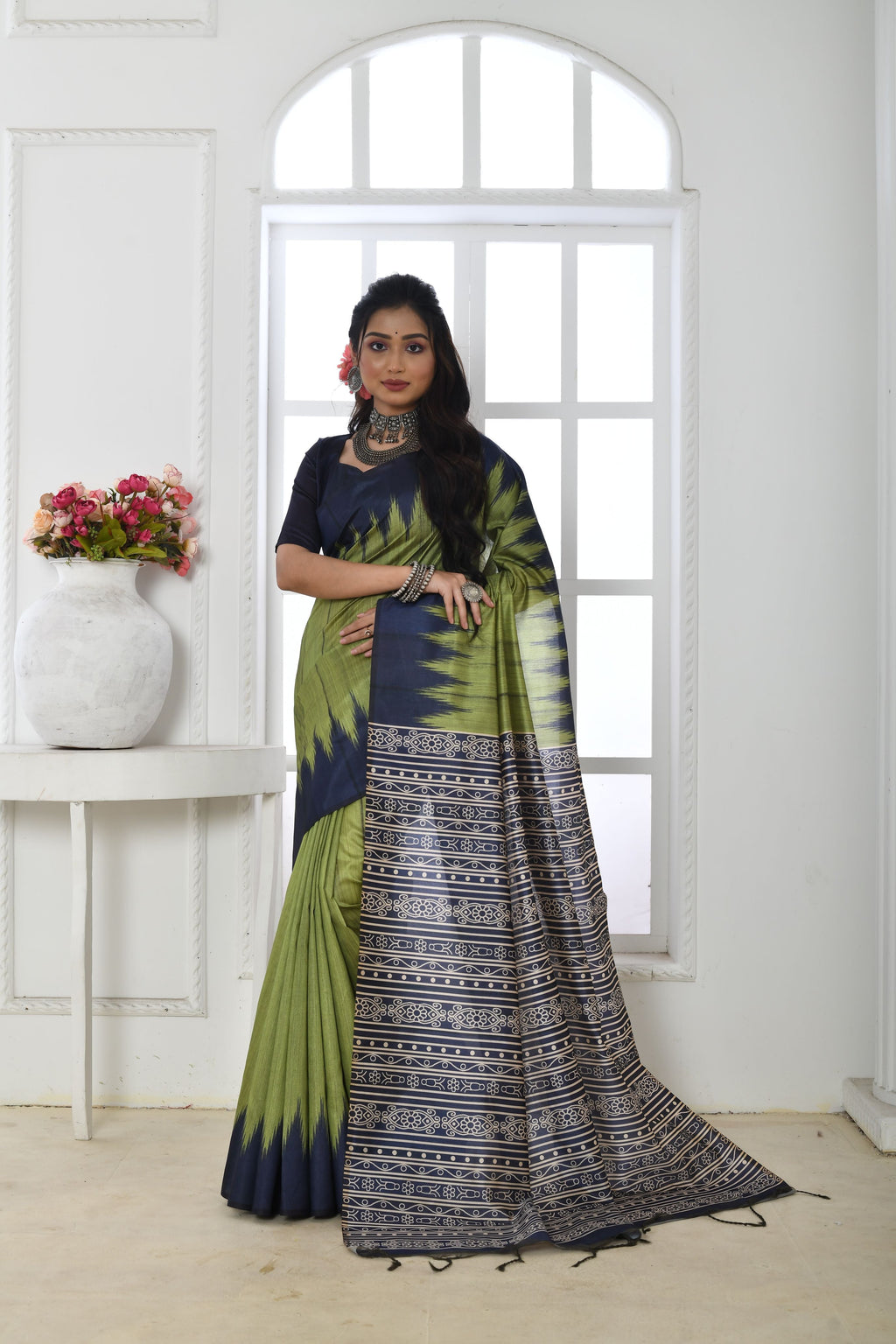 Mehendi green soft Tussar silk saree with traditional printed temple border detail