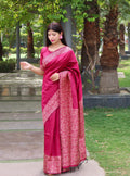 Elegant pink handloom raw silk saree with a printed border and matching blouse