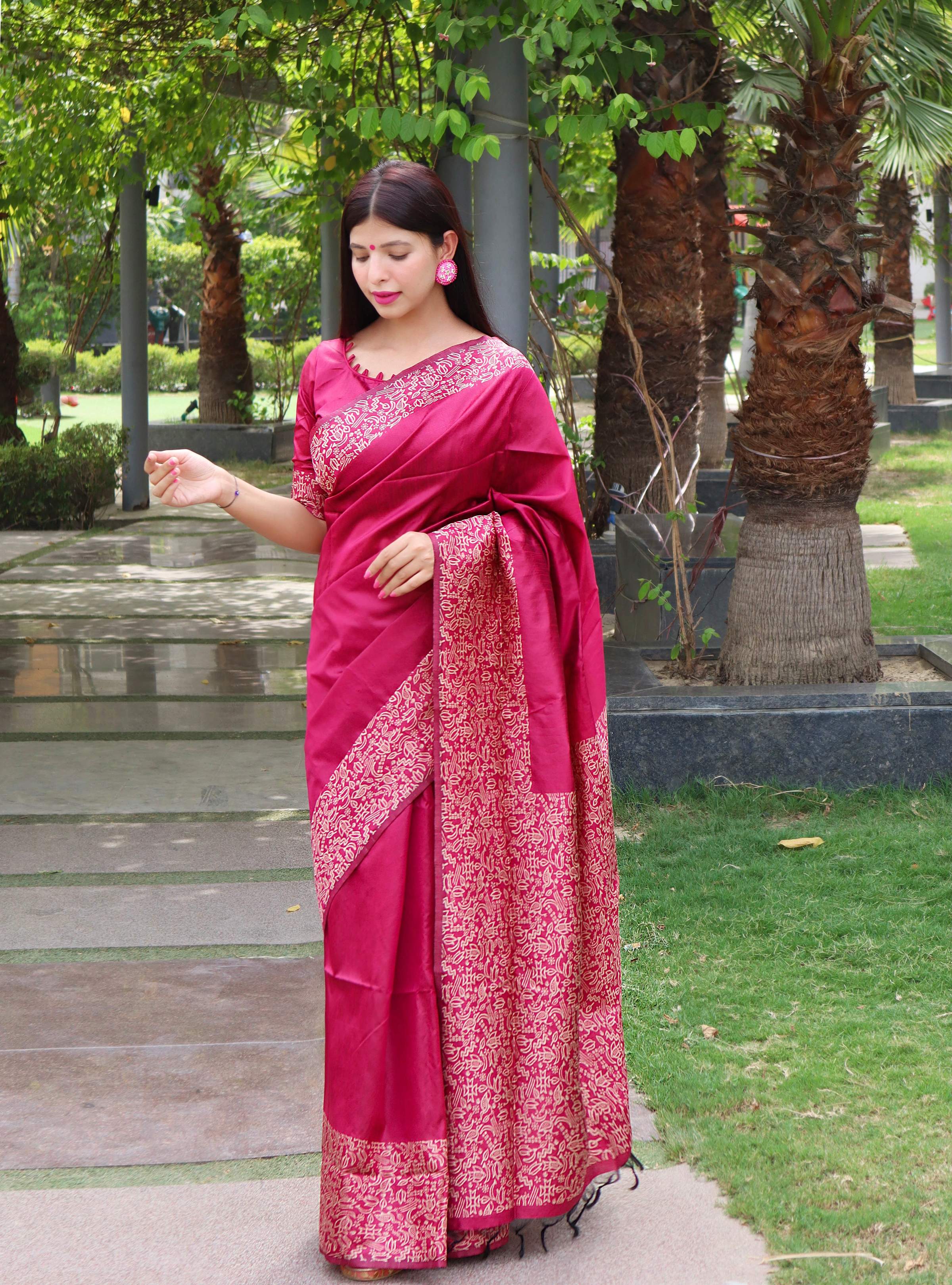 Elegant pink handloom raw silk saree with a printed border and matching blouse