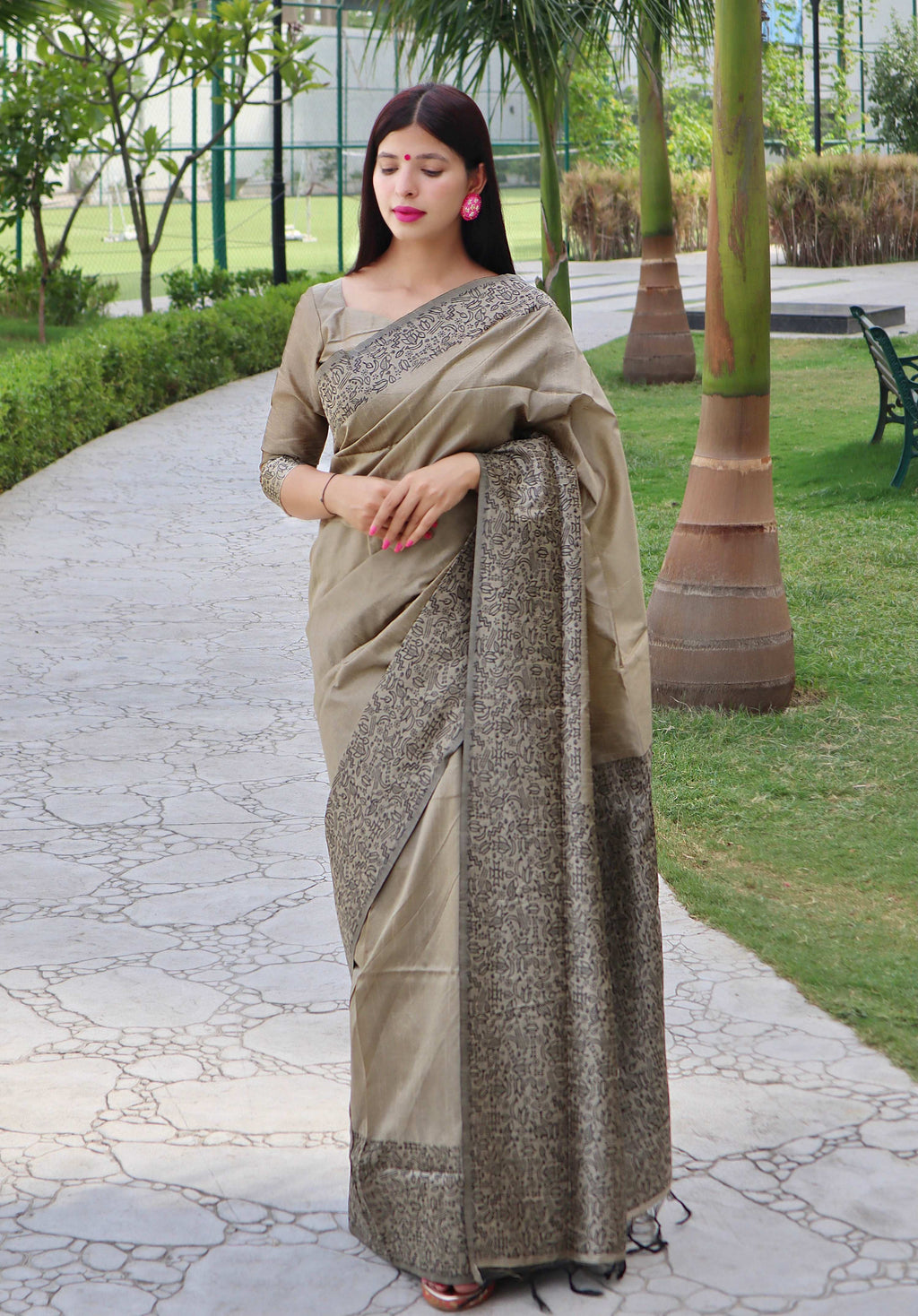Cream handloom raw silk saree with a decorative printed border