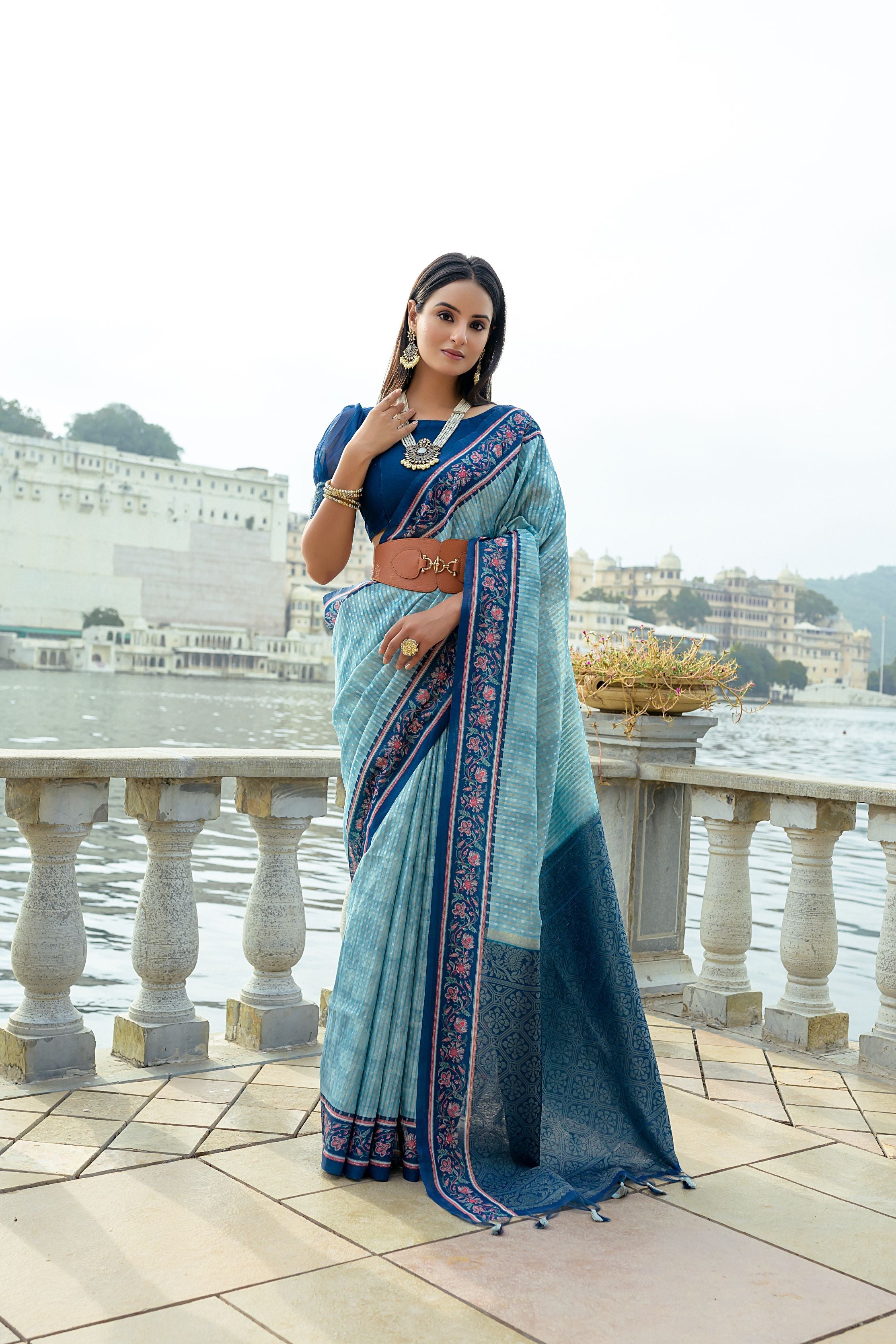 Firozi soft silk traditional saree with golden zari woven patterns