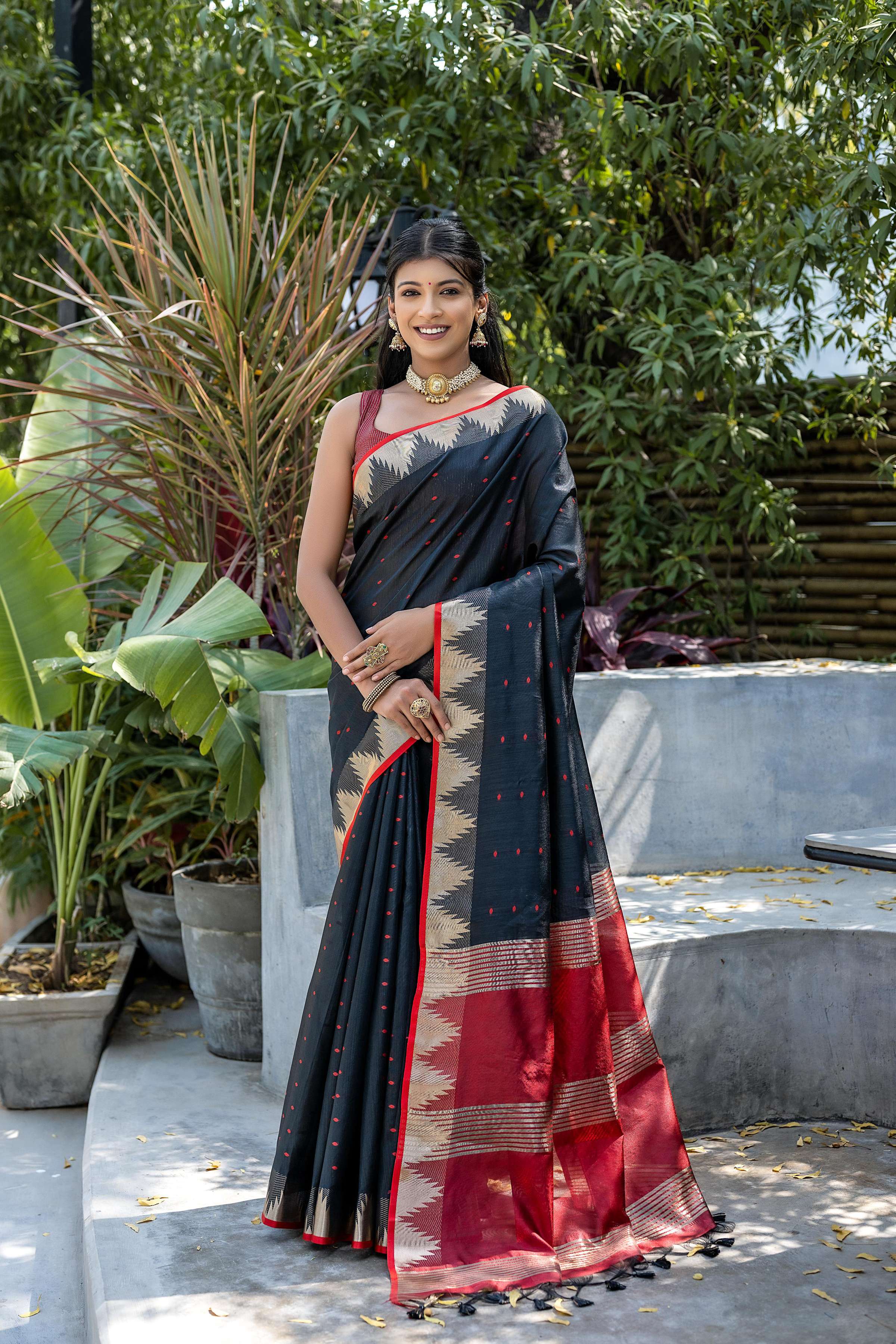 Black semi tussar silk saree with traditional gold zari temple border and matching blouse piece