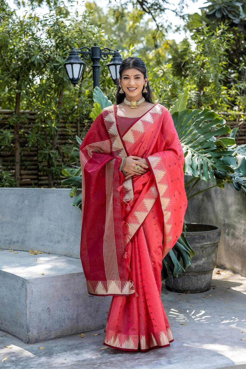 Coral semi tussar silk saree with gold zari temple border and matching blouse