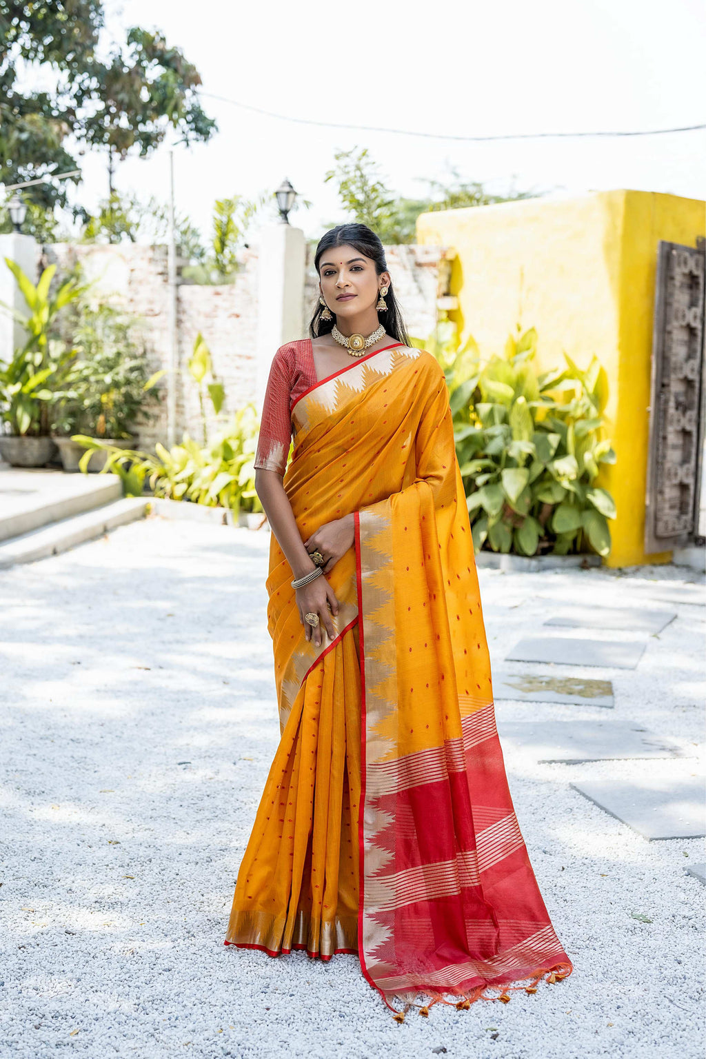 Mustard tussar silk saree with traditional temple border and zari detailing