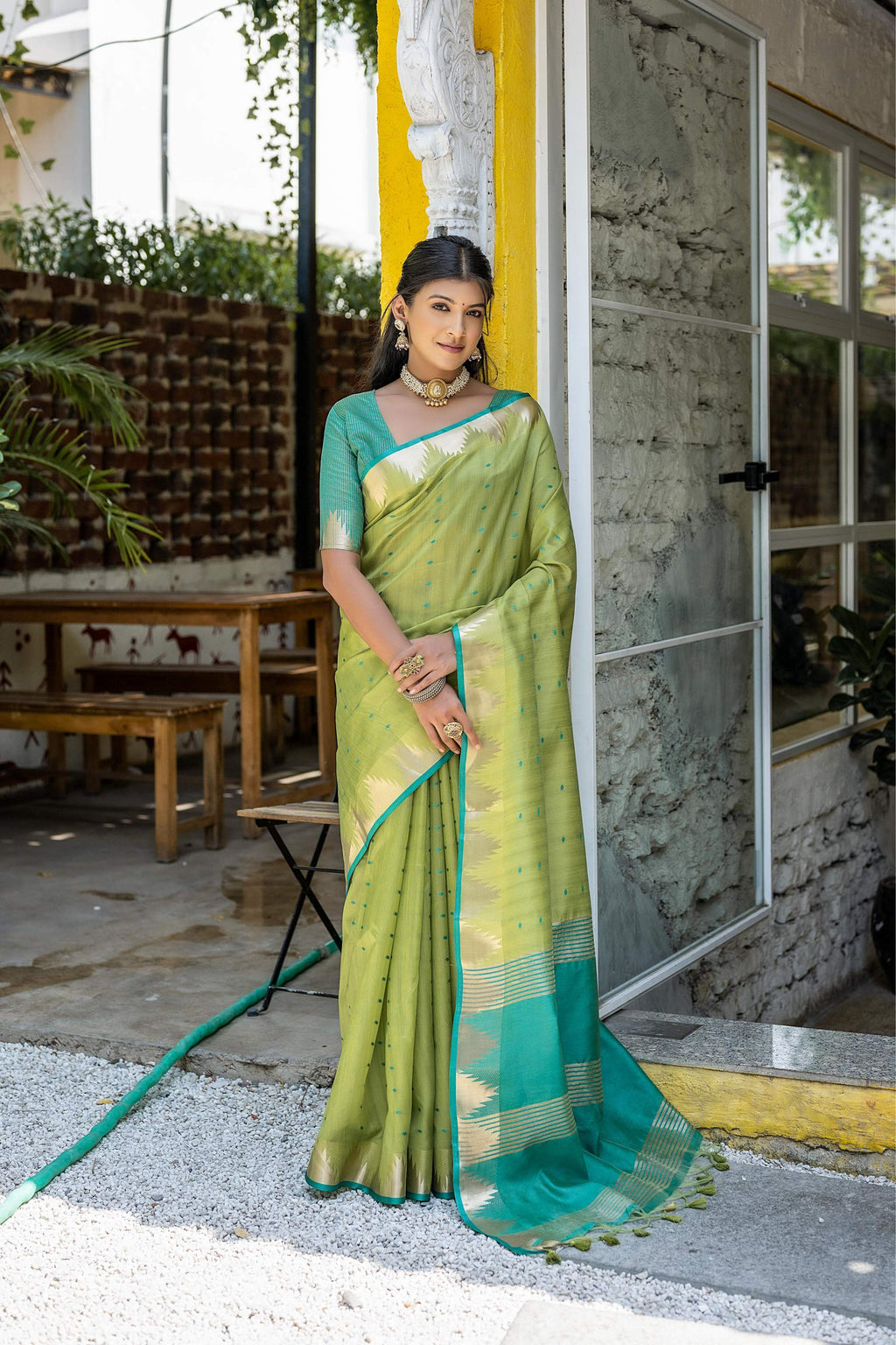 Green semi tussar silk saree with traditional zari temple border