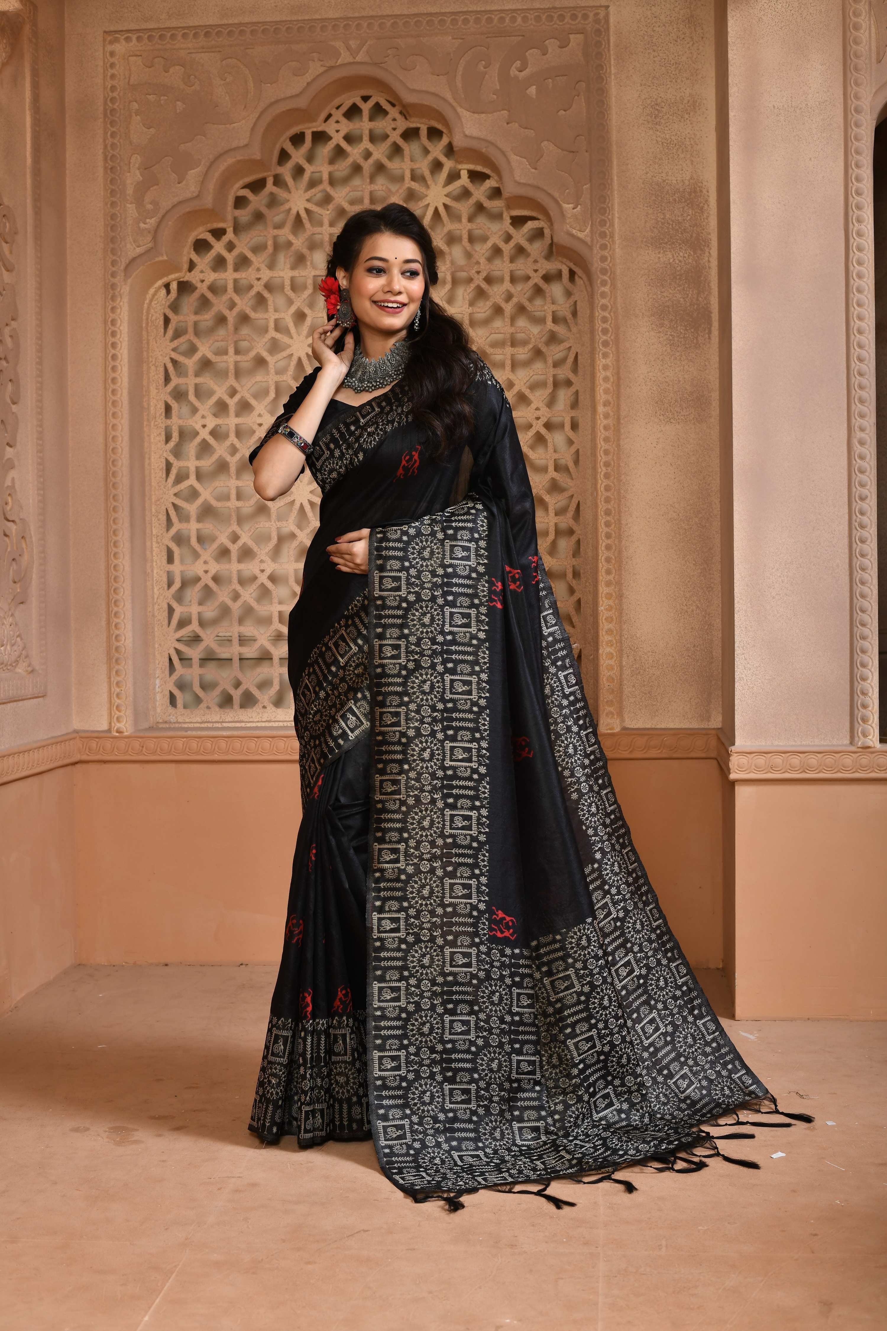 Elegant black handloom raw silk saree with woven pallu design and matching blouse piece