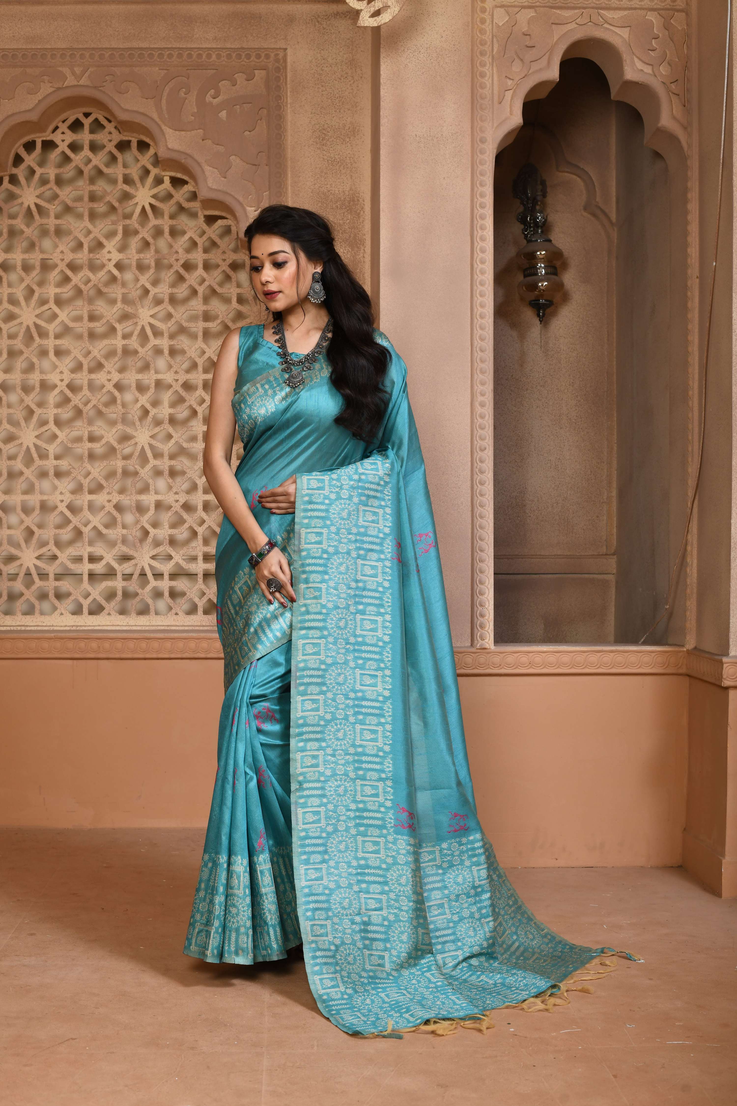 Firozi handloom raw silk saree with a heavily woven pallu