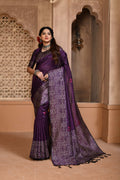 Purple handloom raw silk saree with an intricate traditional woven pallu