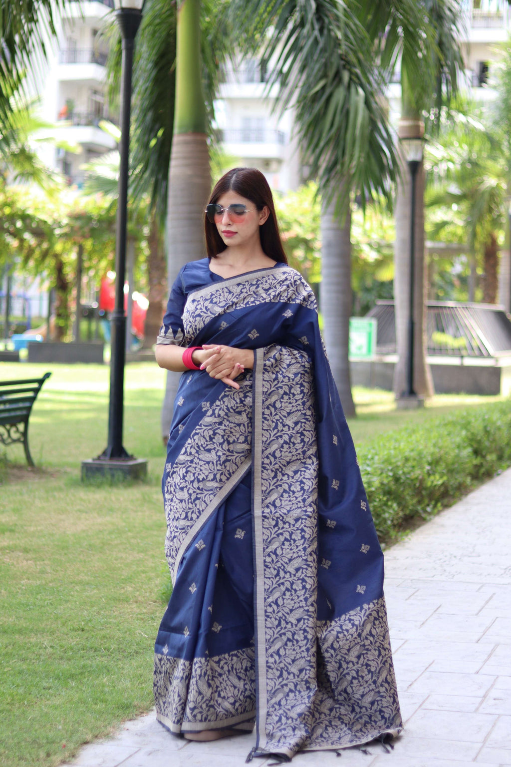 Elegant navy blue handloom raw silk saree with intricate weaving pallu and matching blouse piece