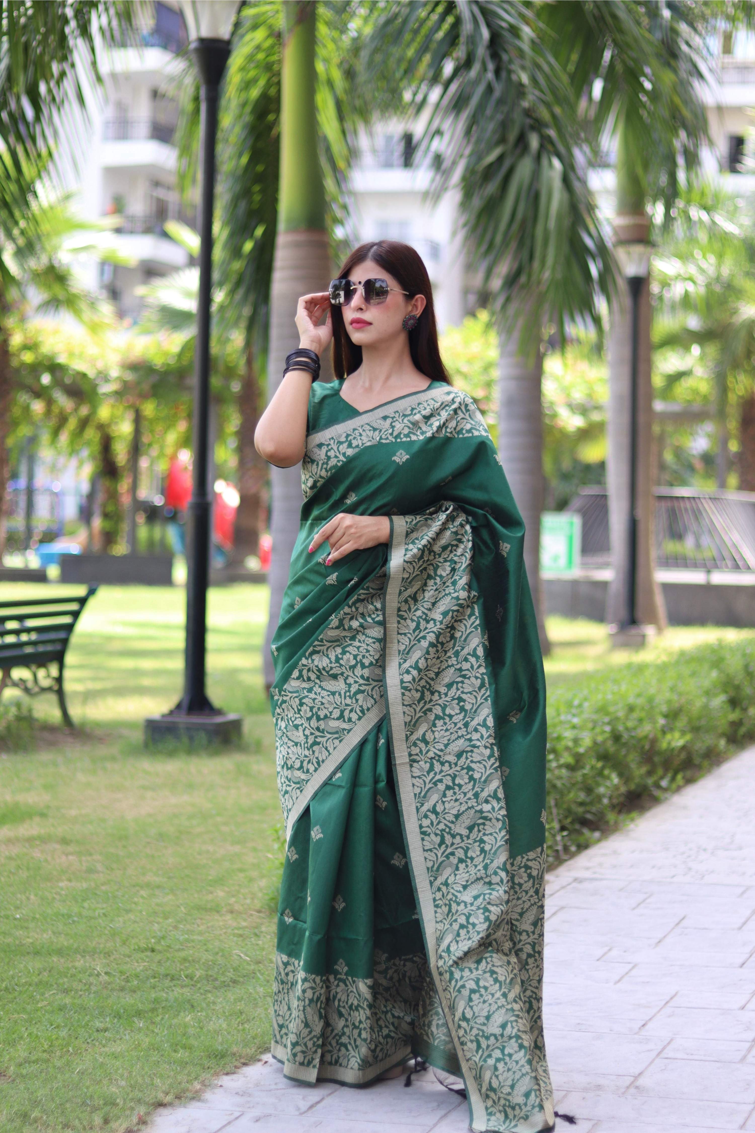 Green Handloom Raw Silk Saree featuring intricate weaving pallu