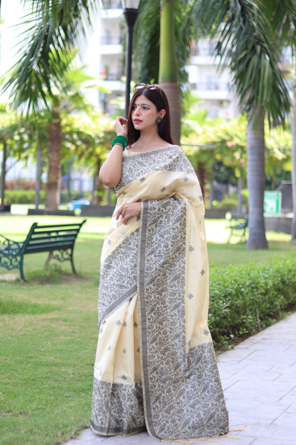 Cream colored handloom raw silk saree with intricate weaving pallu design