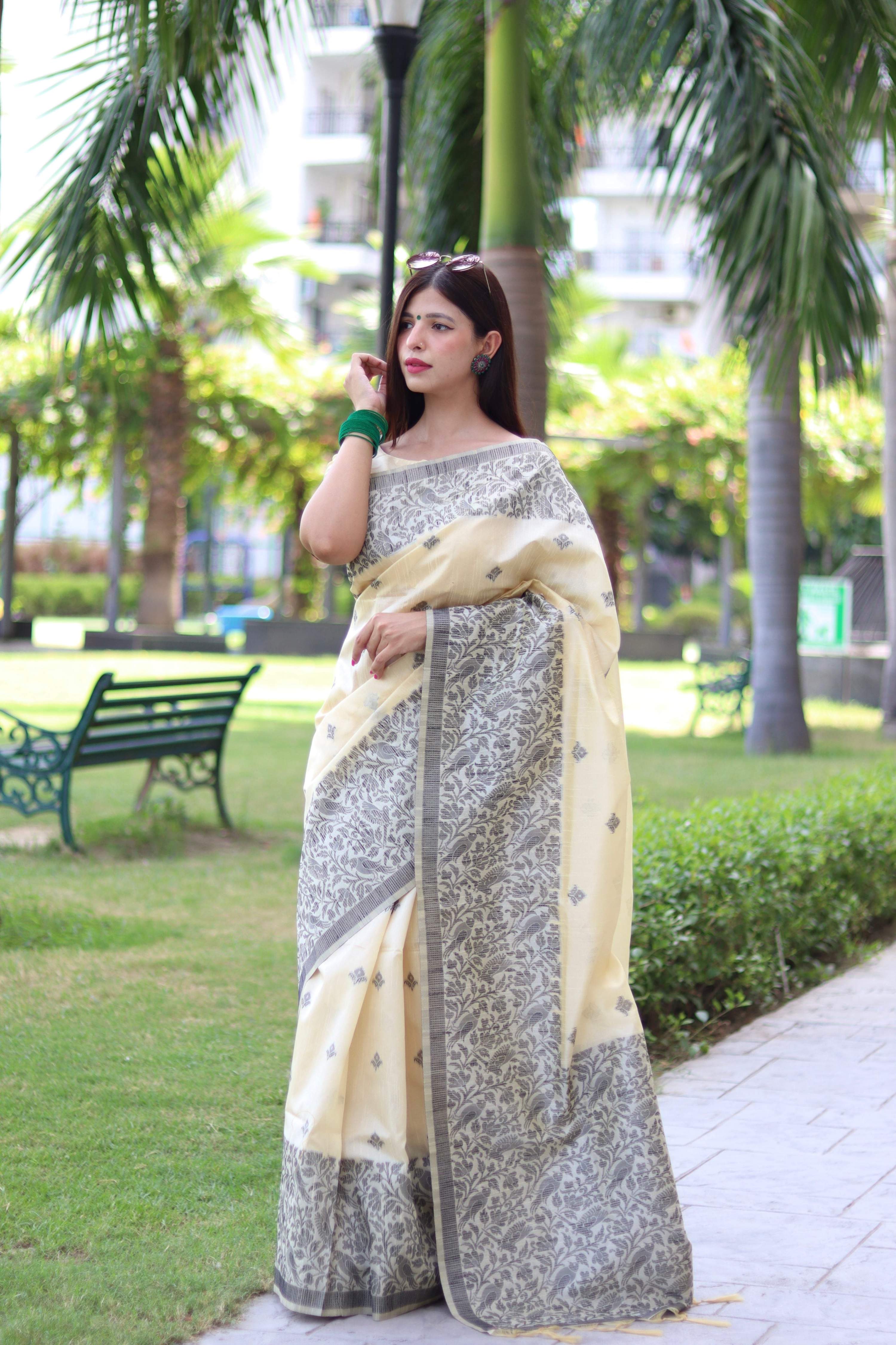 Cream colored handloom raw silk saree with intricate weaving pallu design