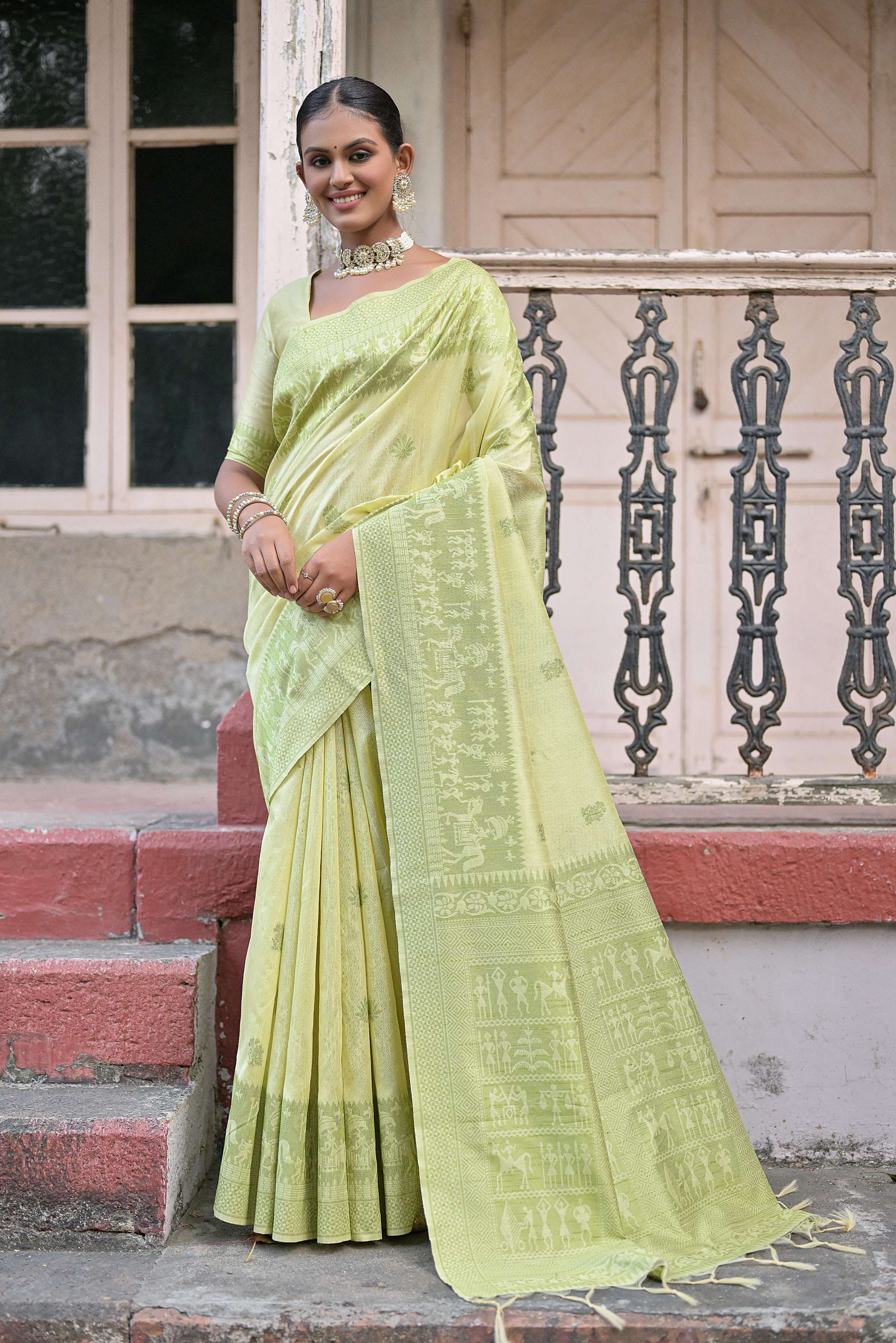 Beautiful light green handloom raw silk saree with a decorative traditional weaving pallu