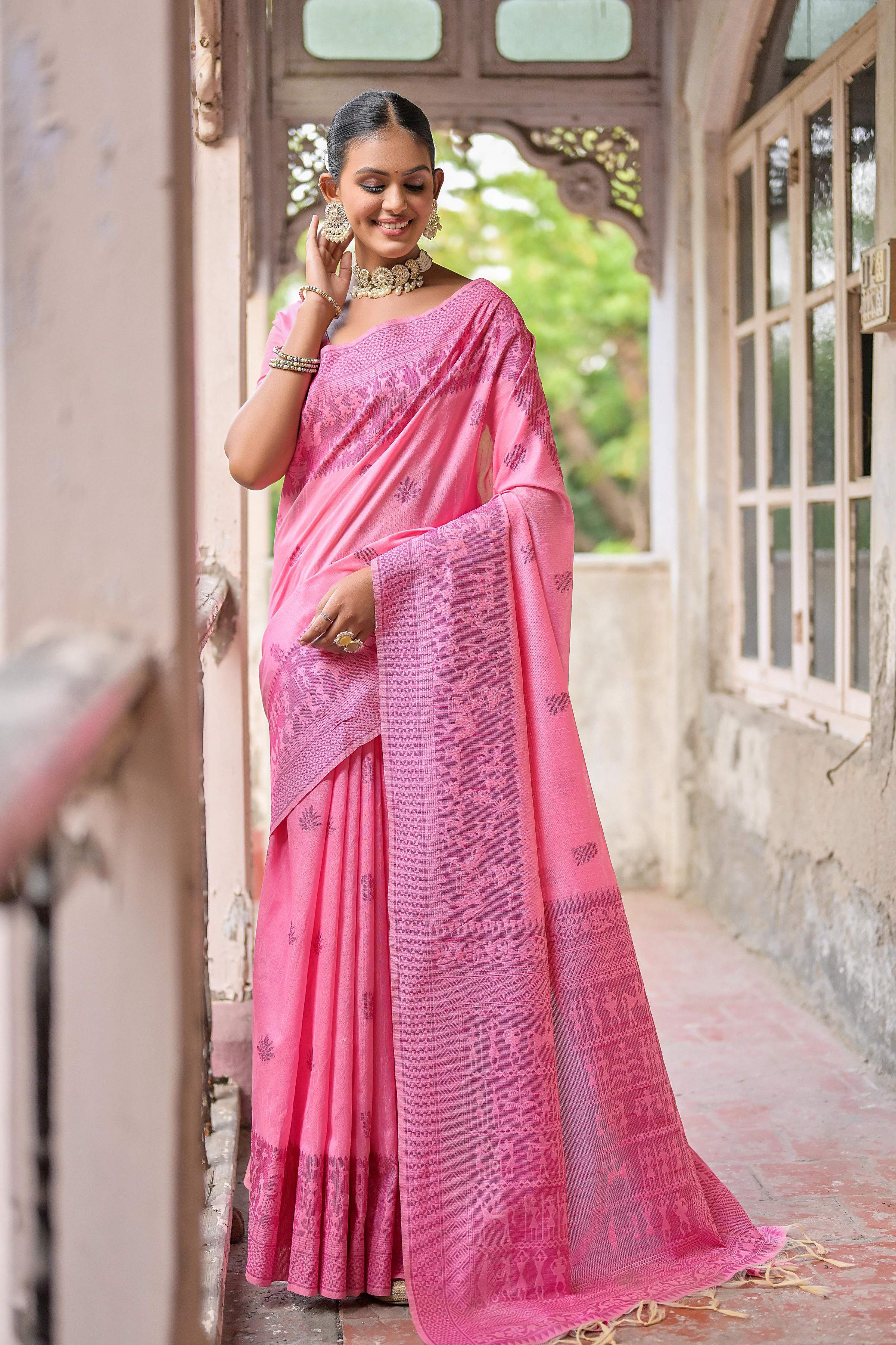 Pink handloom raw silk saree with intricate weaving pallu and matching blouse