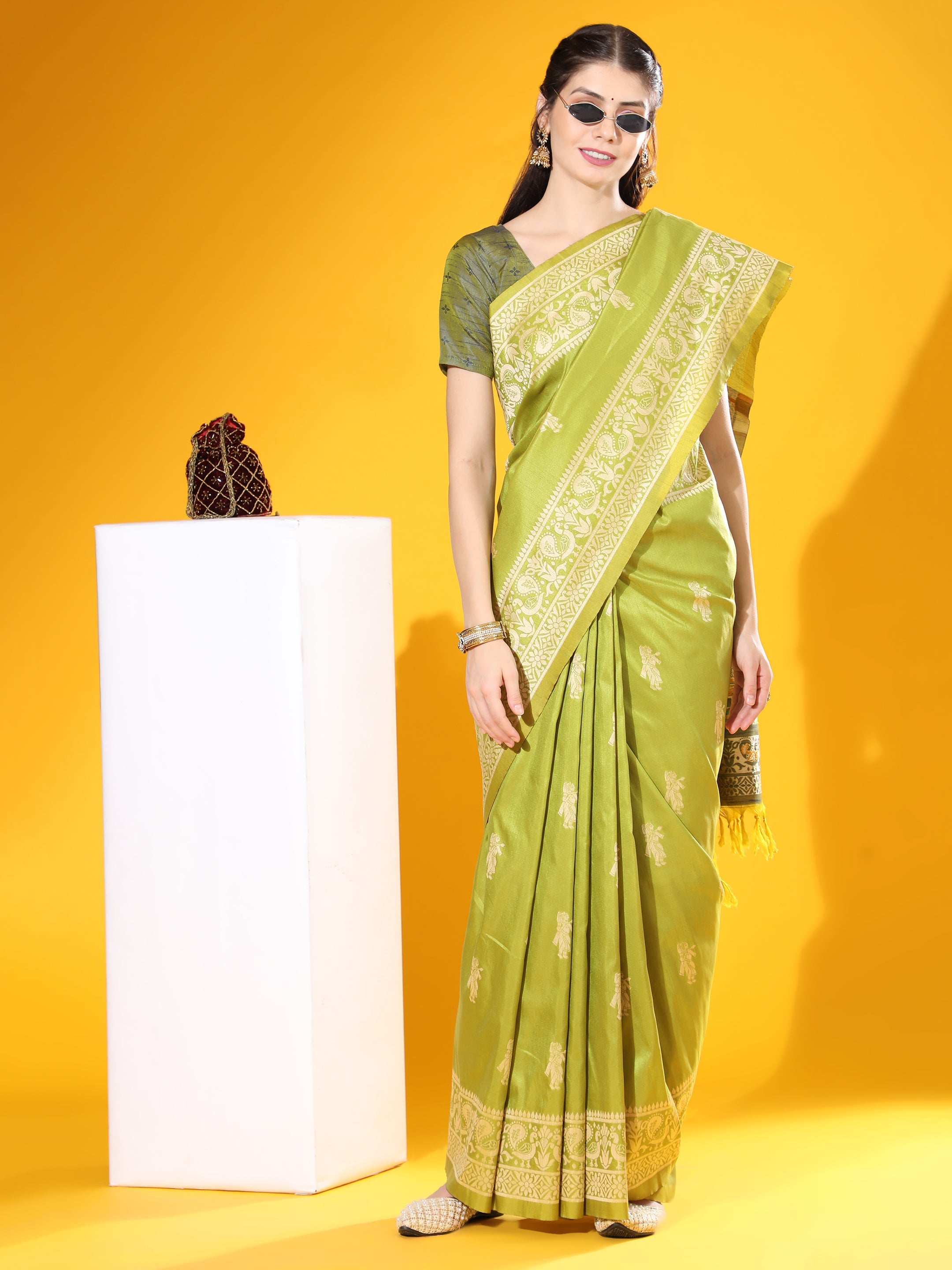 Mehendi-green soft raw silk saree with gold two-tone weaving and matching blouse