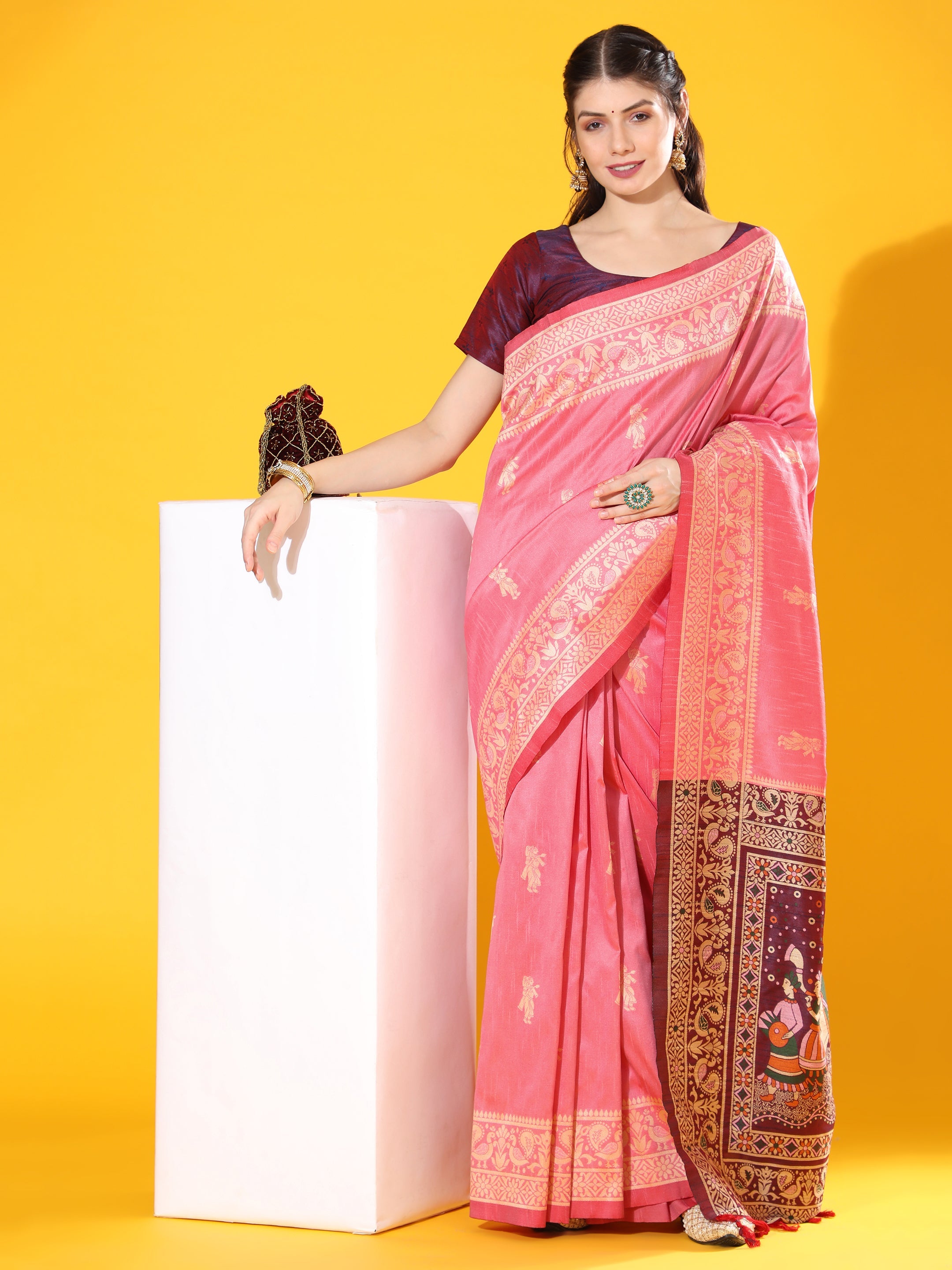 Pink soft raw silk saree featuring traditional two-tone weaving with a matching blouse piece