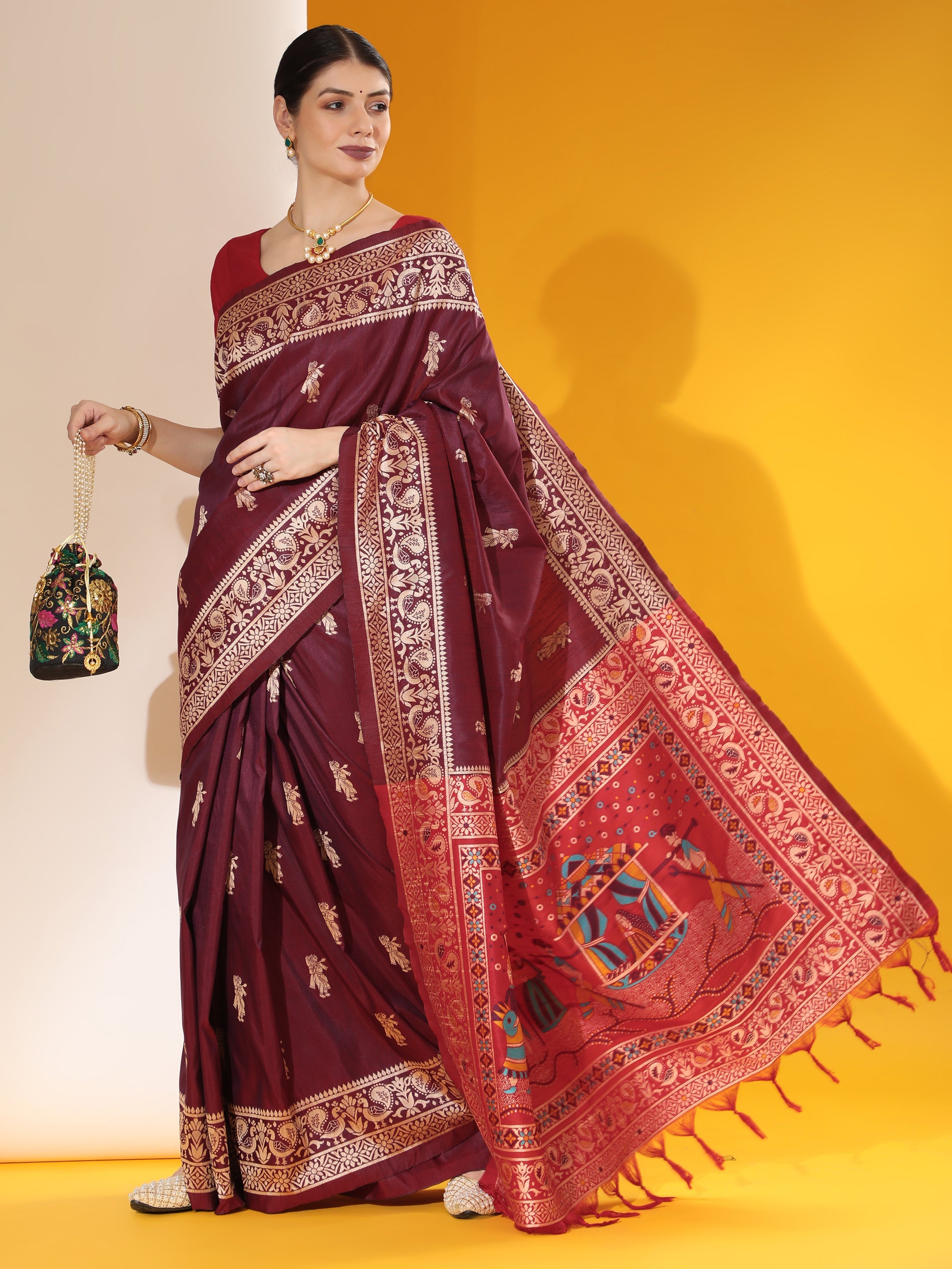 Wine two-tone raw silk saree with elegant weaving detail