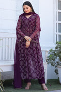 Wine colored Bandhani print georgette kurta set featuring bell sleeves and matching dupatta