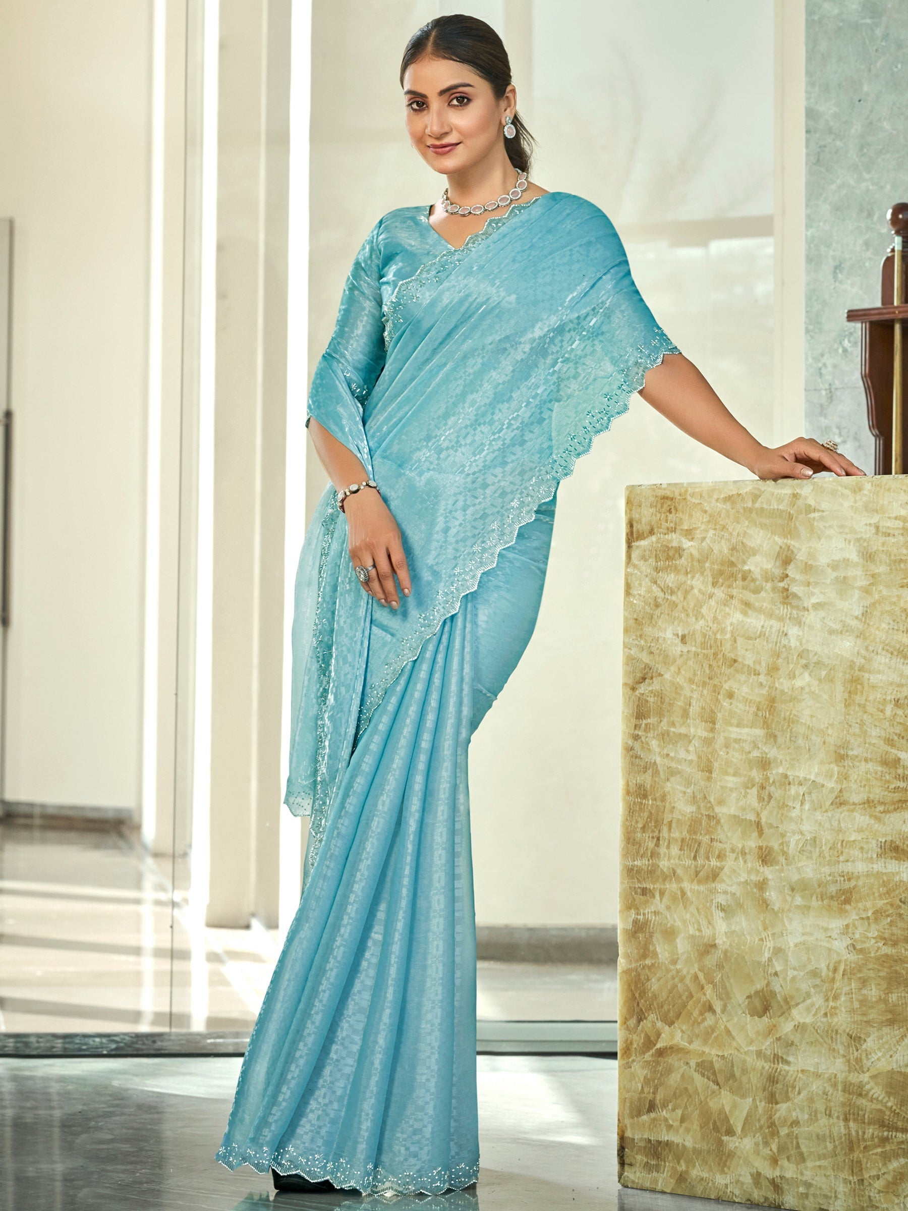 Sky blue silk blend saree with intricate bead and crystal cutwork border