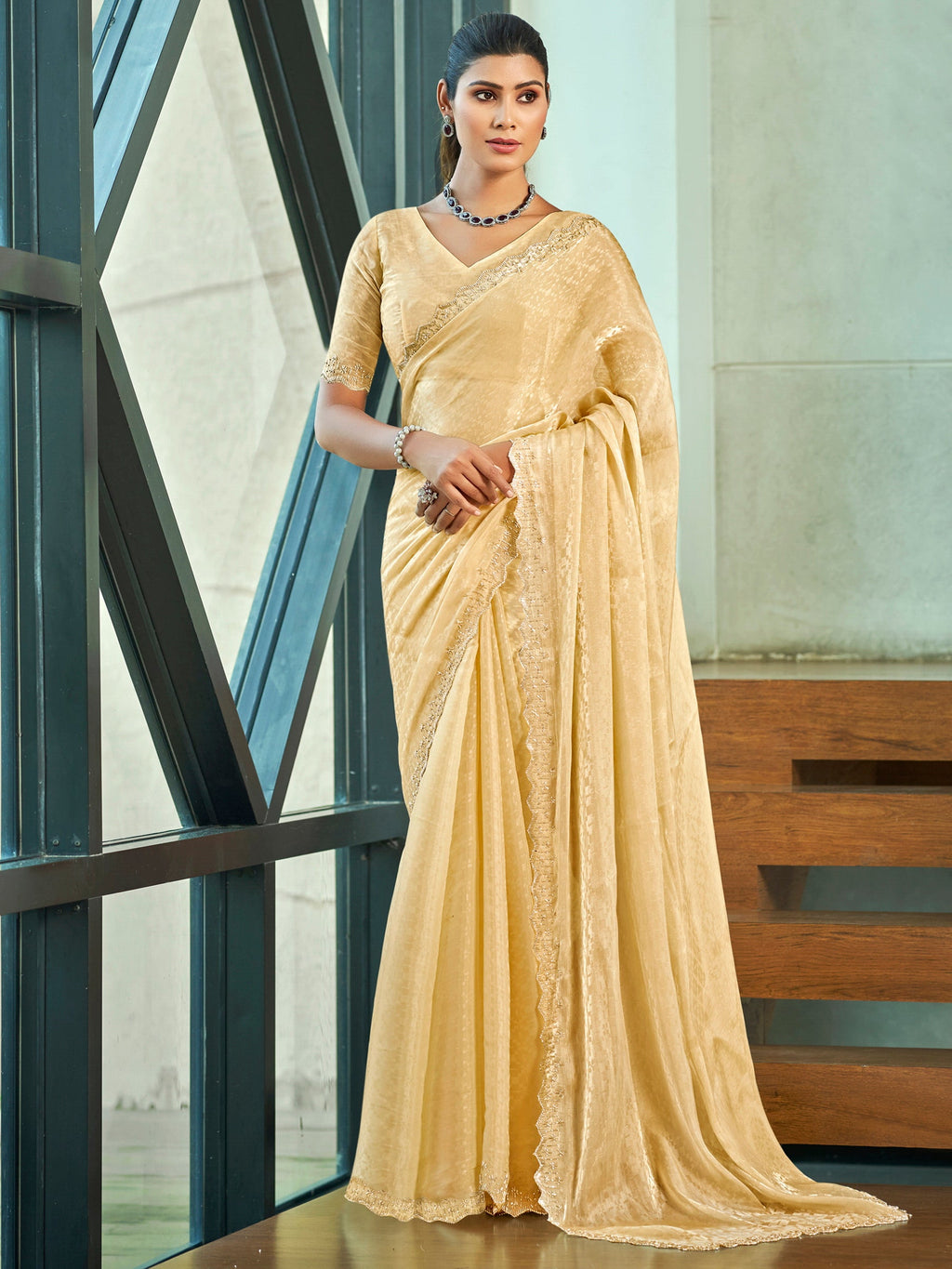 Ivory silk blend saree featuring detailed beaded and crystal cutwork border
