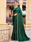Green shimmer chiffon saree with embellished border and crystal detailing.