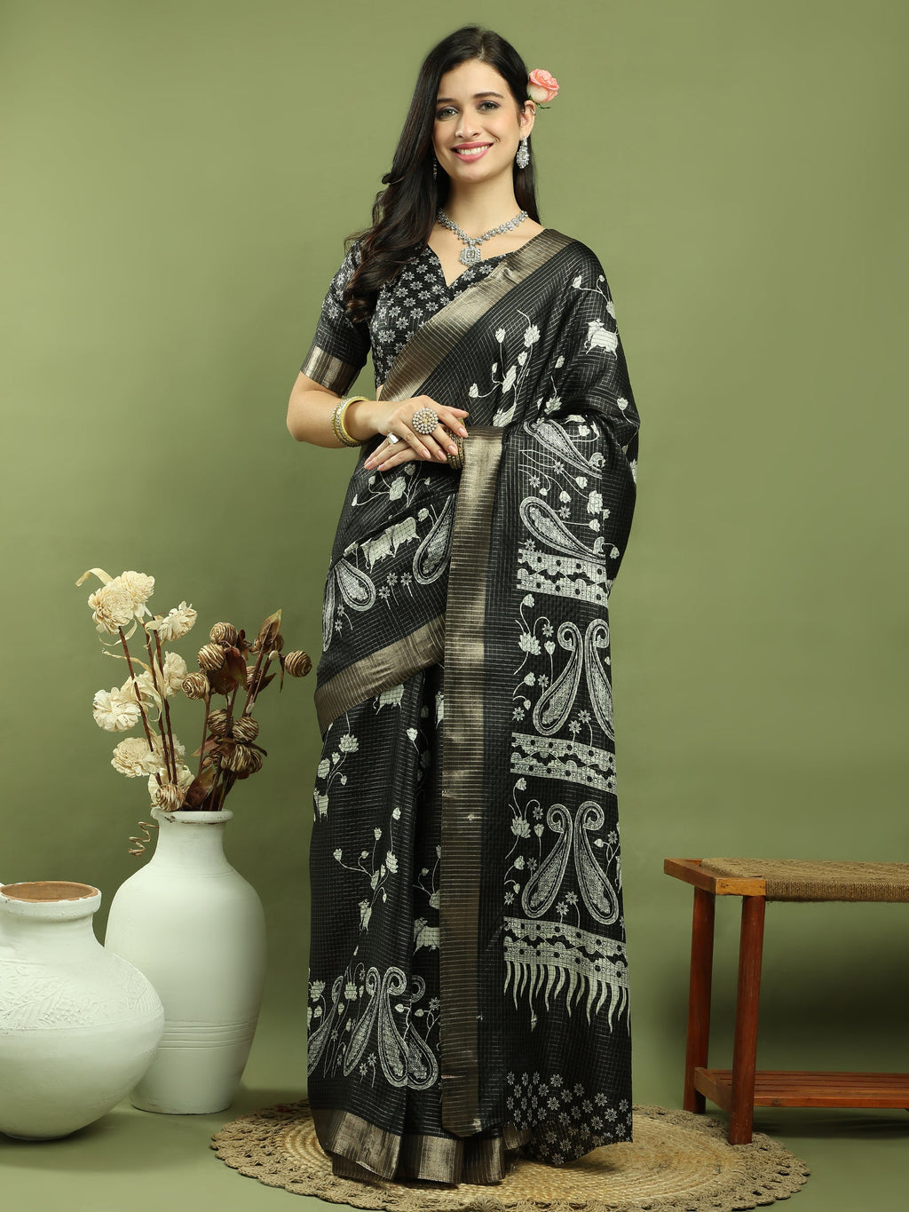 Black silk blend saree with floral prints and traditional gold Jari weaving