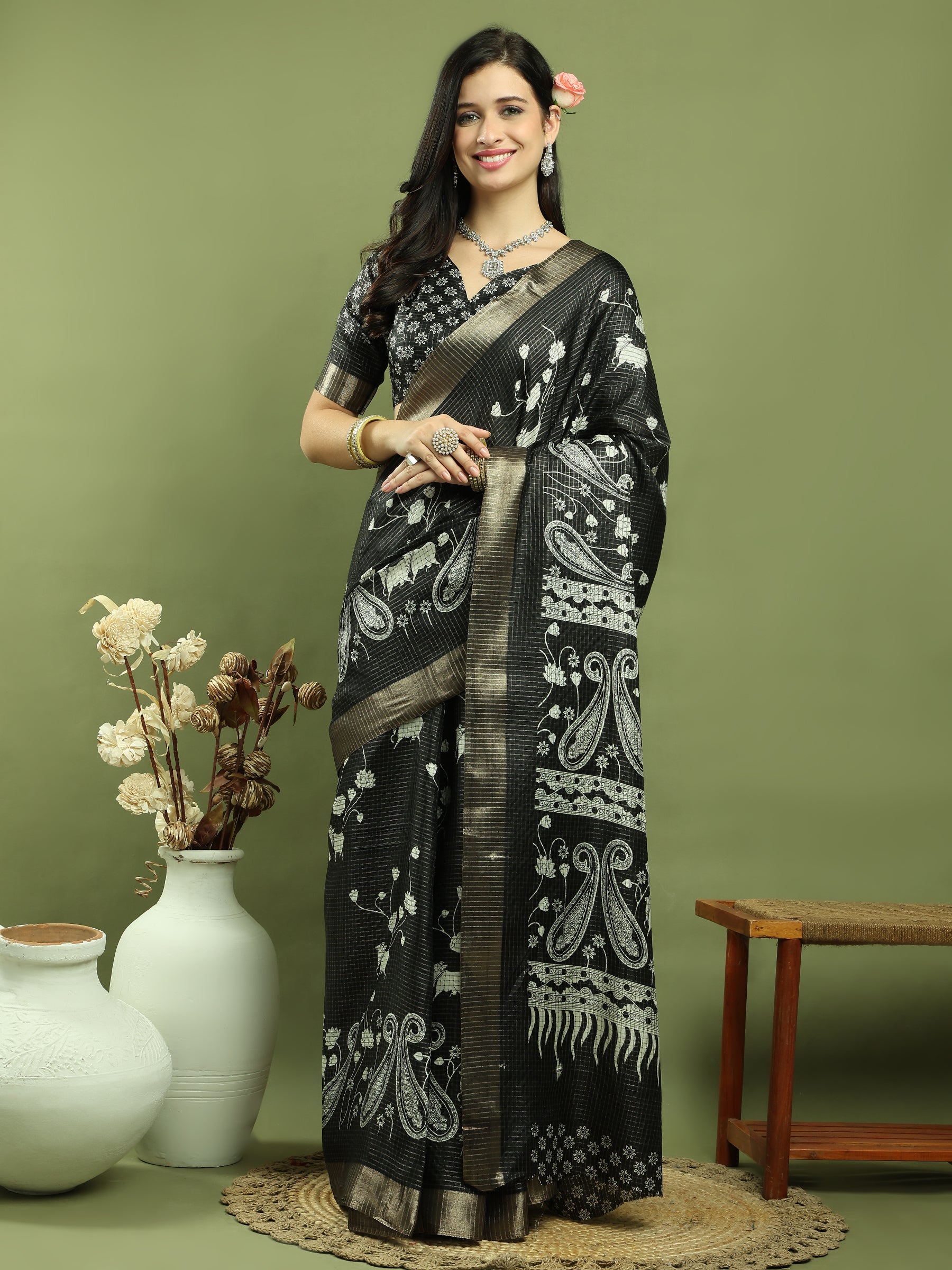 Black silk blend saree with floral prints and traditional gold Jari weaving