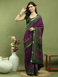 Purple silk blend saree featuring Ikat floral prints and an elegant gold jari border