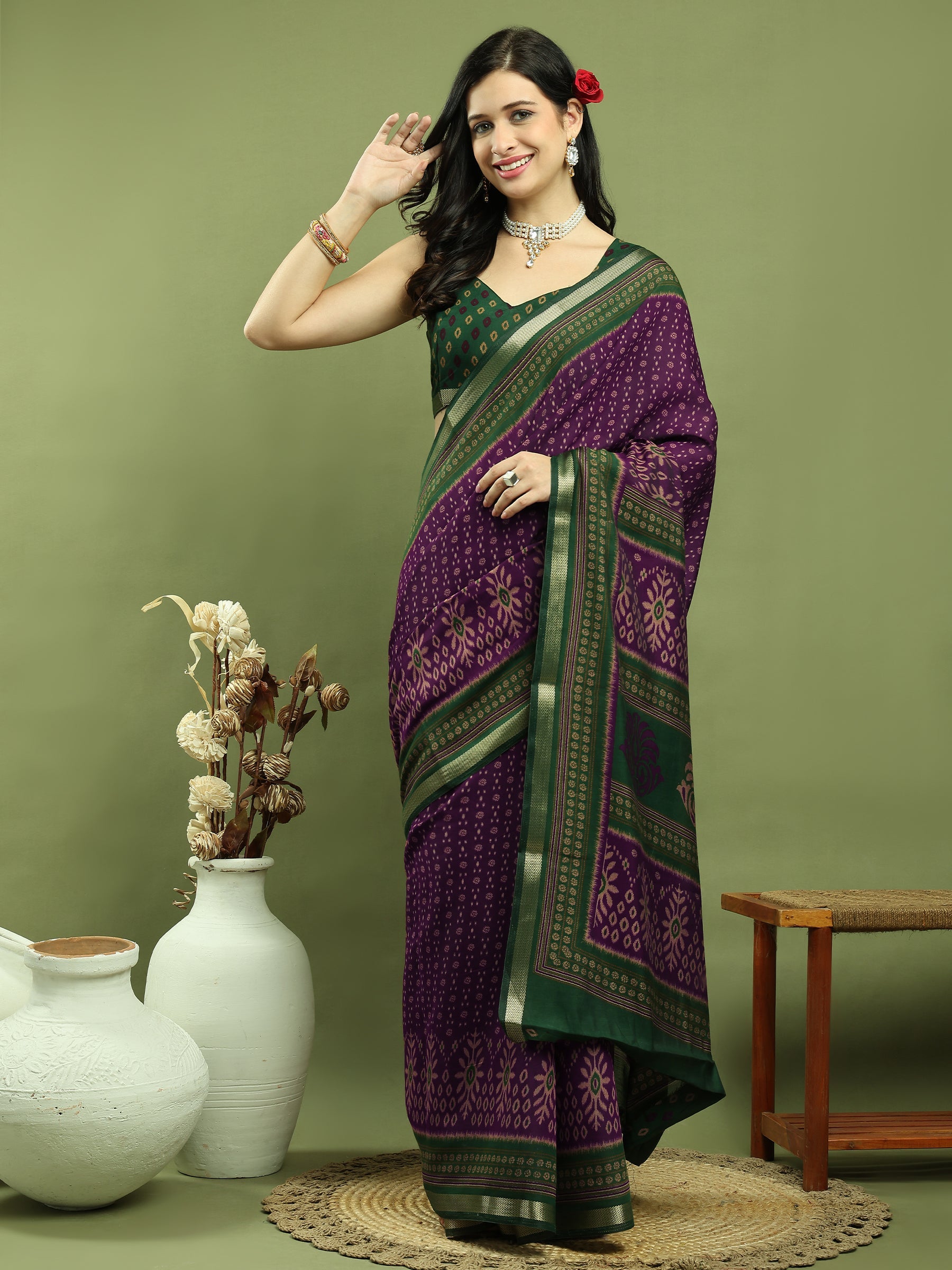 Purple silk blend saree featuring Ikat floral prints and an elegant gold jari border