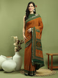Mustard silk blend saree with Ikat floral print and traditional jari border.