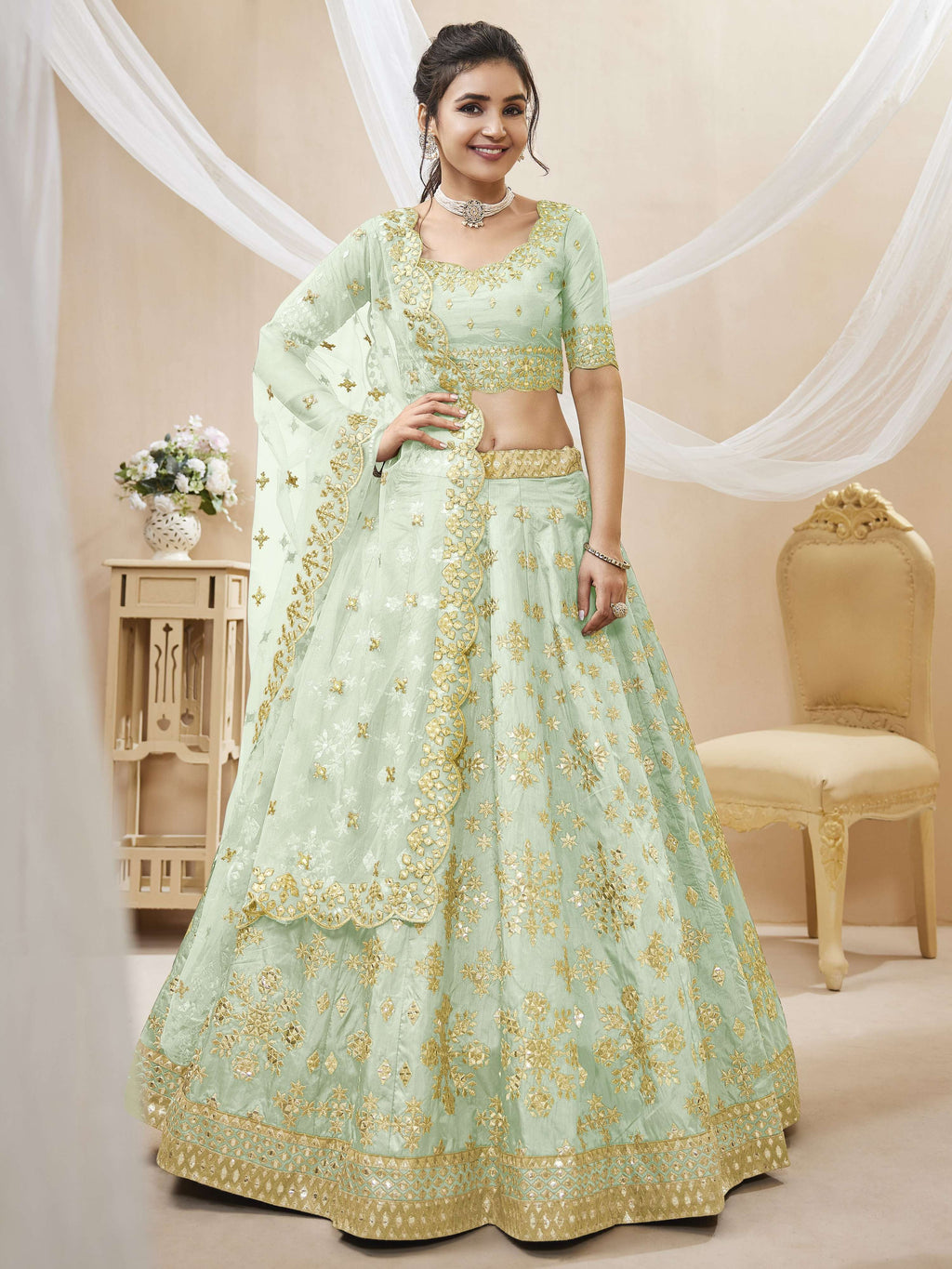 Pista Art Silk lehenga with sequins, foil, and zari embroidery details