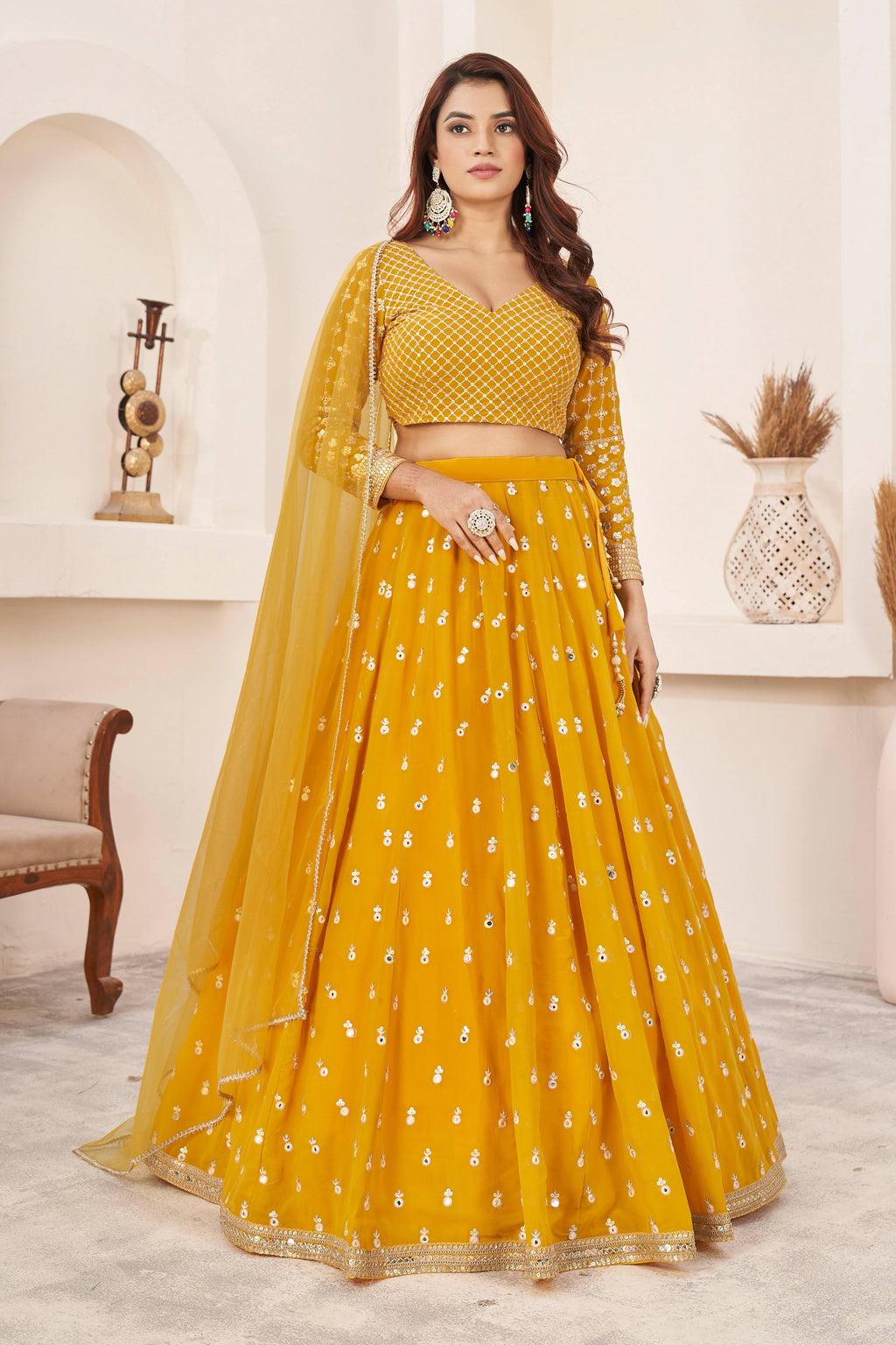 Yellow georgette lehenga choli with multi-colored thread and sequins embroidery