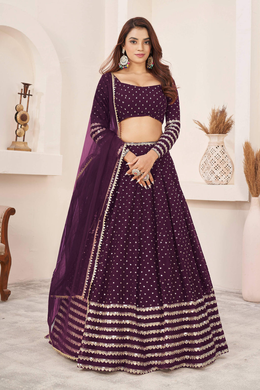 Wine colored georgette lehenga choli with sequins and zari work