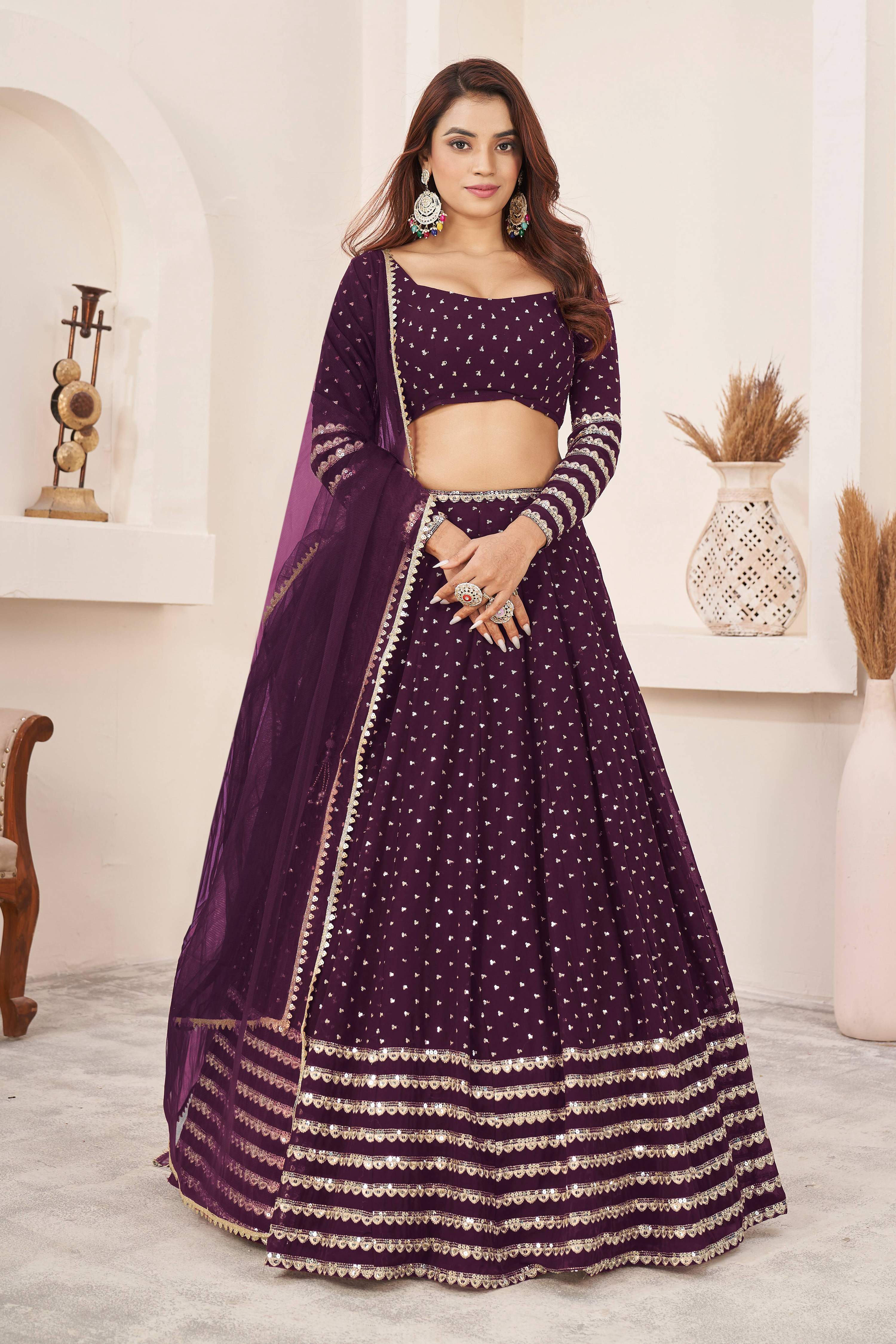Wine colored georgette lehenga choli with sequins and zari work