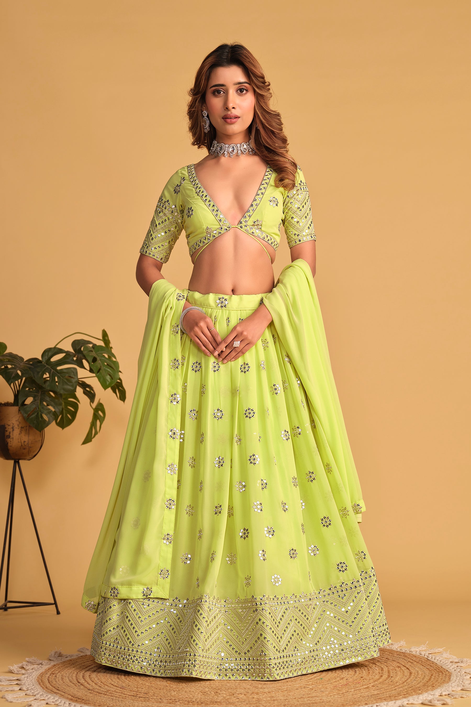 Neon green georgette lehenga choli with heavy silver sequins and zari embroidery