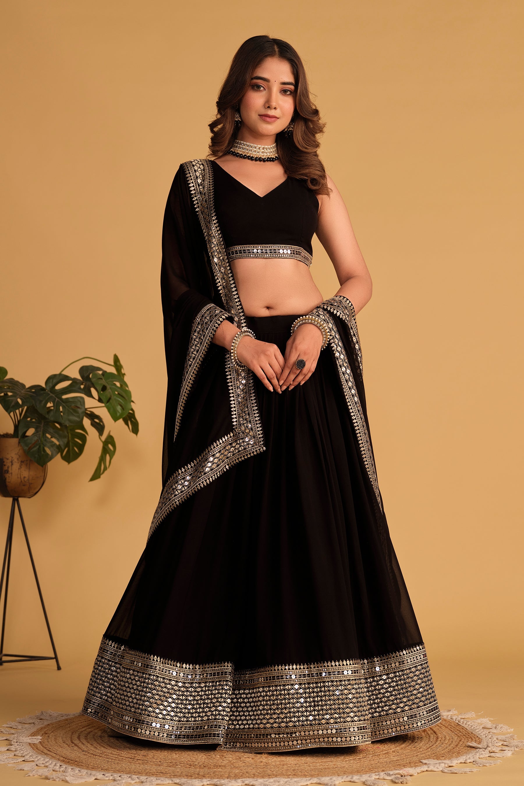 Black georgette lehenga choli with heavy sequins and zari embroidery
