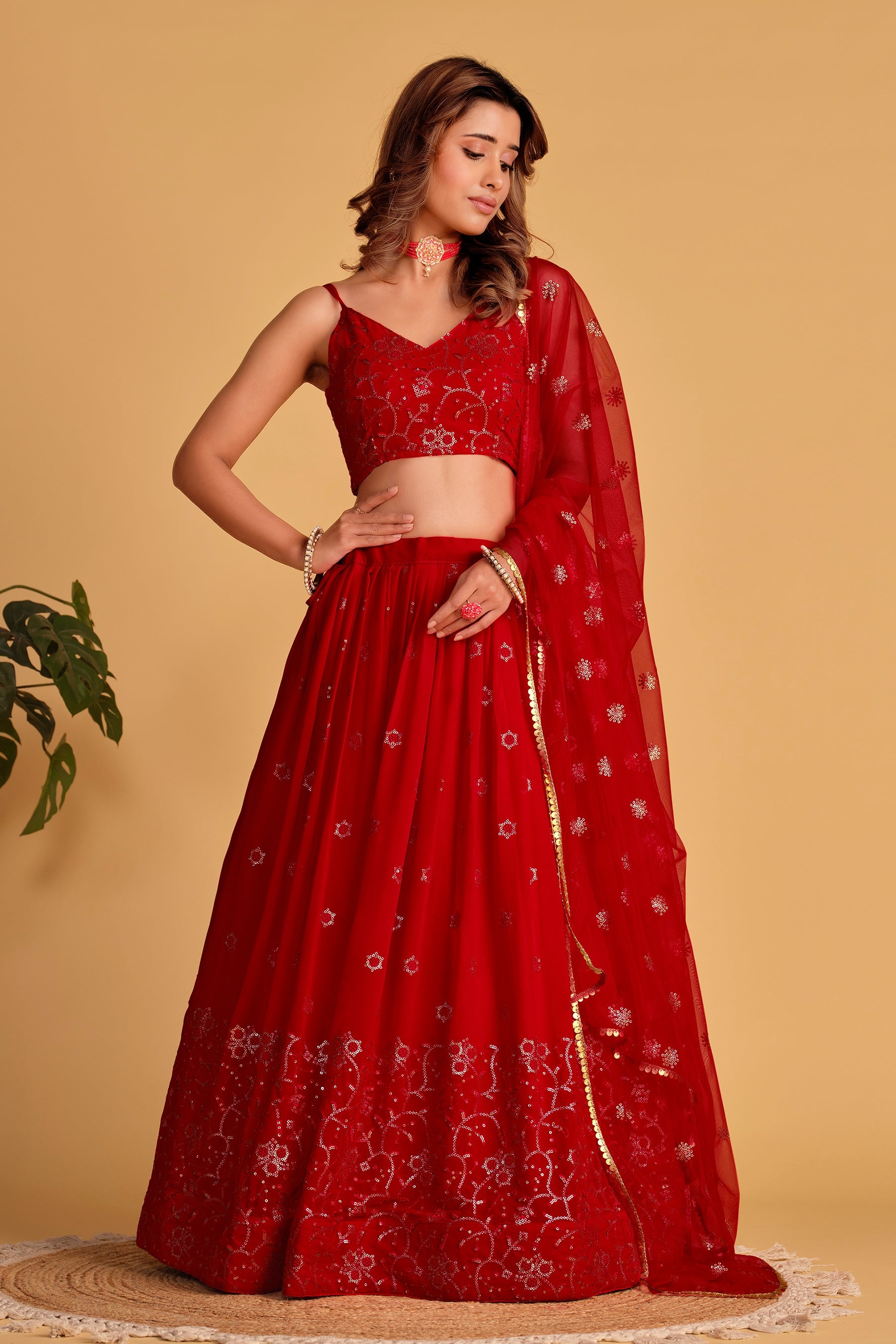 Classic red georgette lehenga choli with detailed sequins and thread embroidery